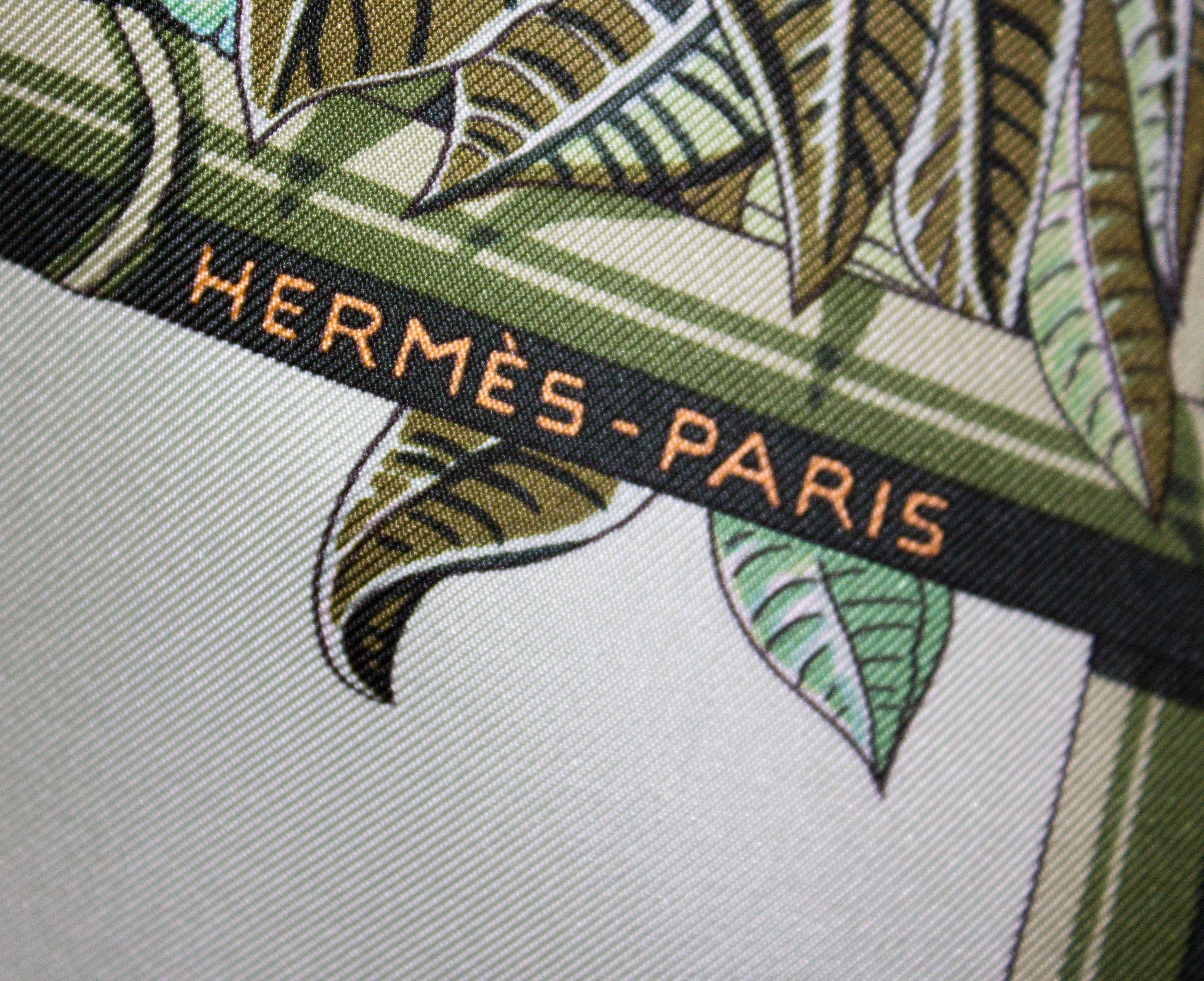 A chic silk scarf from  Hermes , Jardin d'Hiver in a wonderful celadon green.
The scarf hasnt been worn and comes with its original bag and tag.
Measurement  36'' square.
