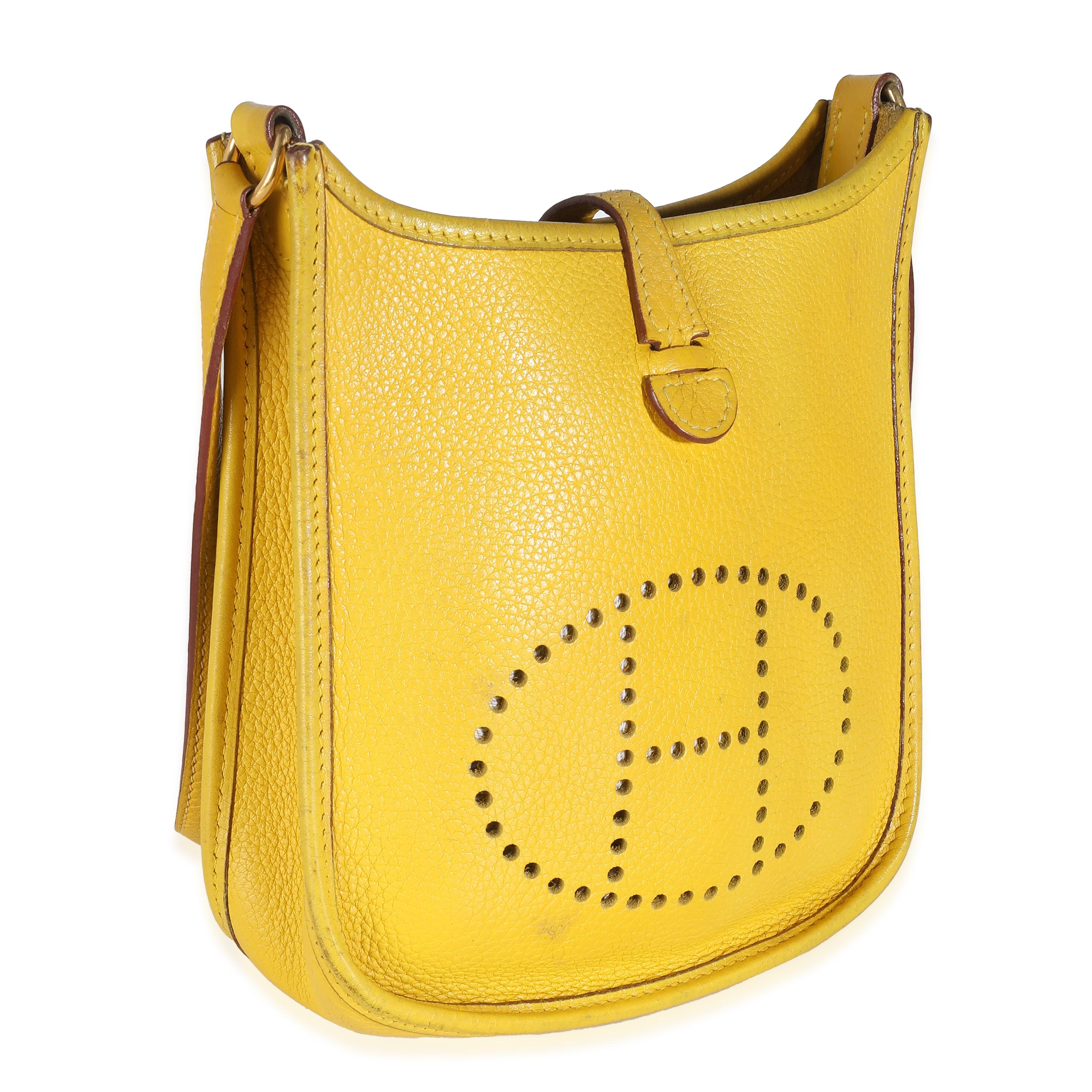 Listing Title: Hermès Jaune Ambre Clemence Mini Evelyne 16 TPM GHW
SKU: 138333
Condition: Pre-owned 
Condition Description: Designed in 1978 by Evelyne Bertrand, the Evelyne shoulder bag from Hermès has a distinctive aesthetic thanks to a perforated
