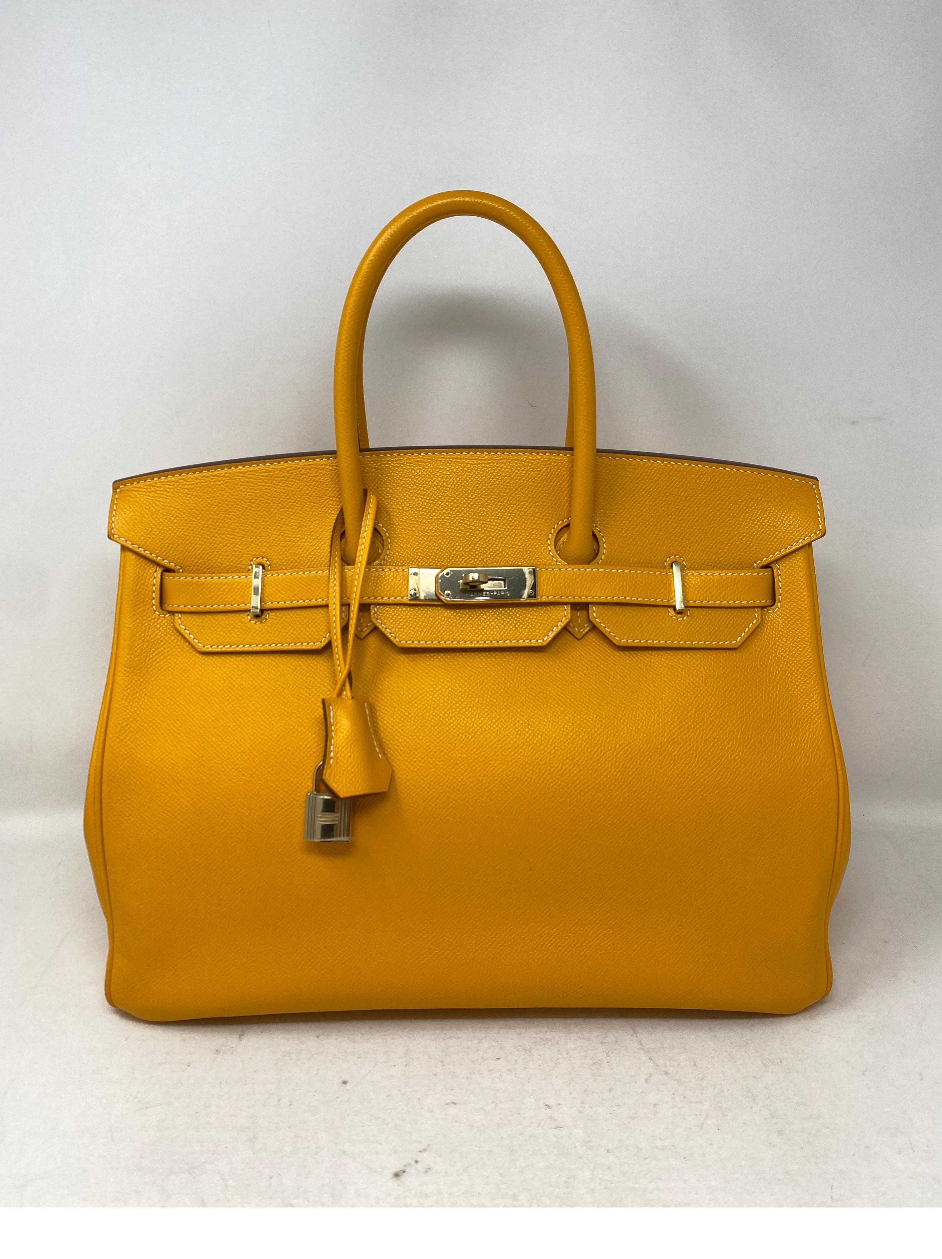 Hermes Jaune Birkin 35 Bag. Candy Birkin Bag. Interior is Potiron Orange leather and exterior of bag is Jaune yellow color. Rare collector's piece. Gold hardware. Epsom leather. Vibrant yellow color that adds pop to any wardrobe. Another great