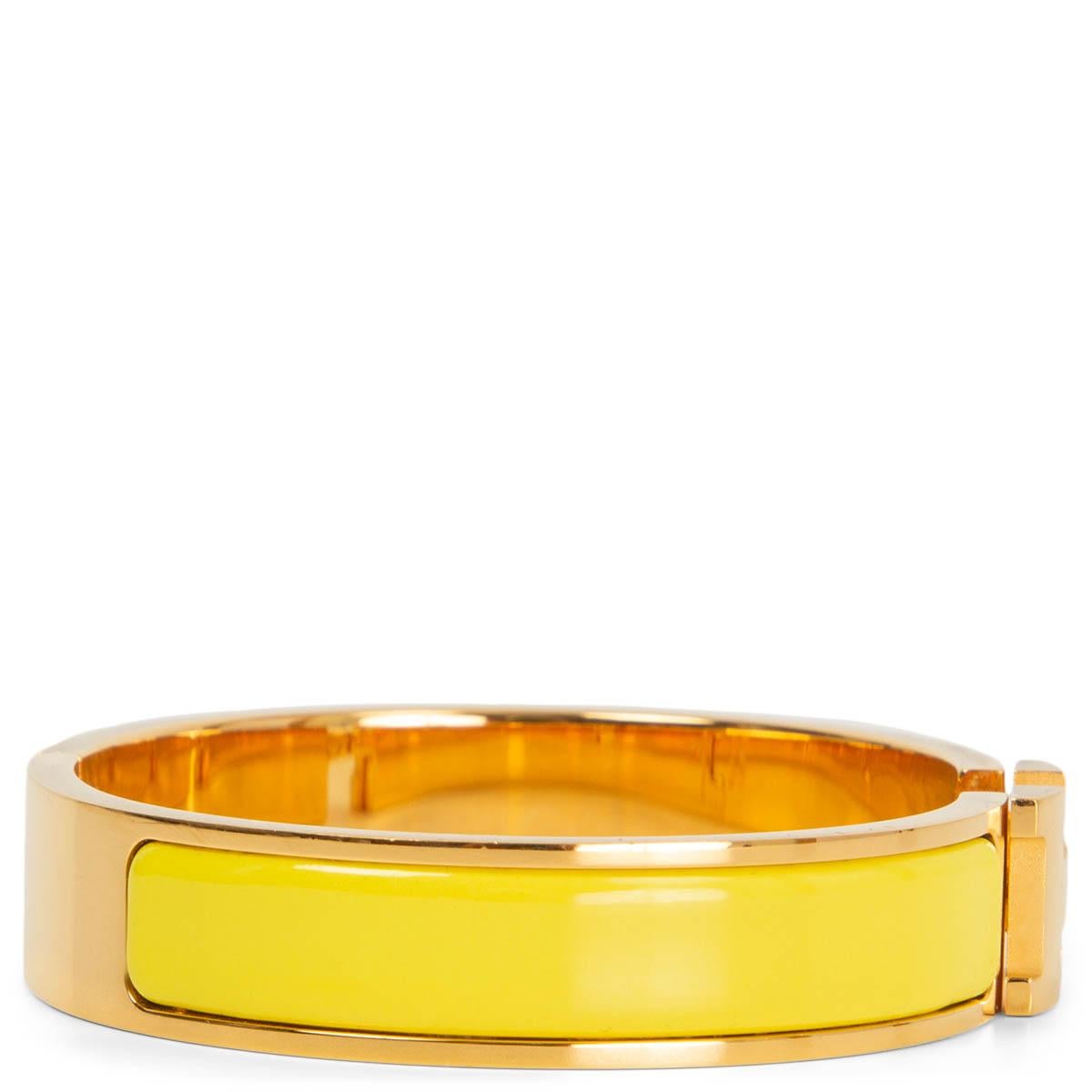 100% authentic Hermès Clic H PM bracelet in jaune Tennis enamel and with yellow gold plated hardware. Has been worn with very faint scratches to the hardware. Overall in excellent condition. Comes with pouch. 

Measurements
Width	1.2cm