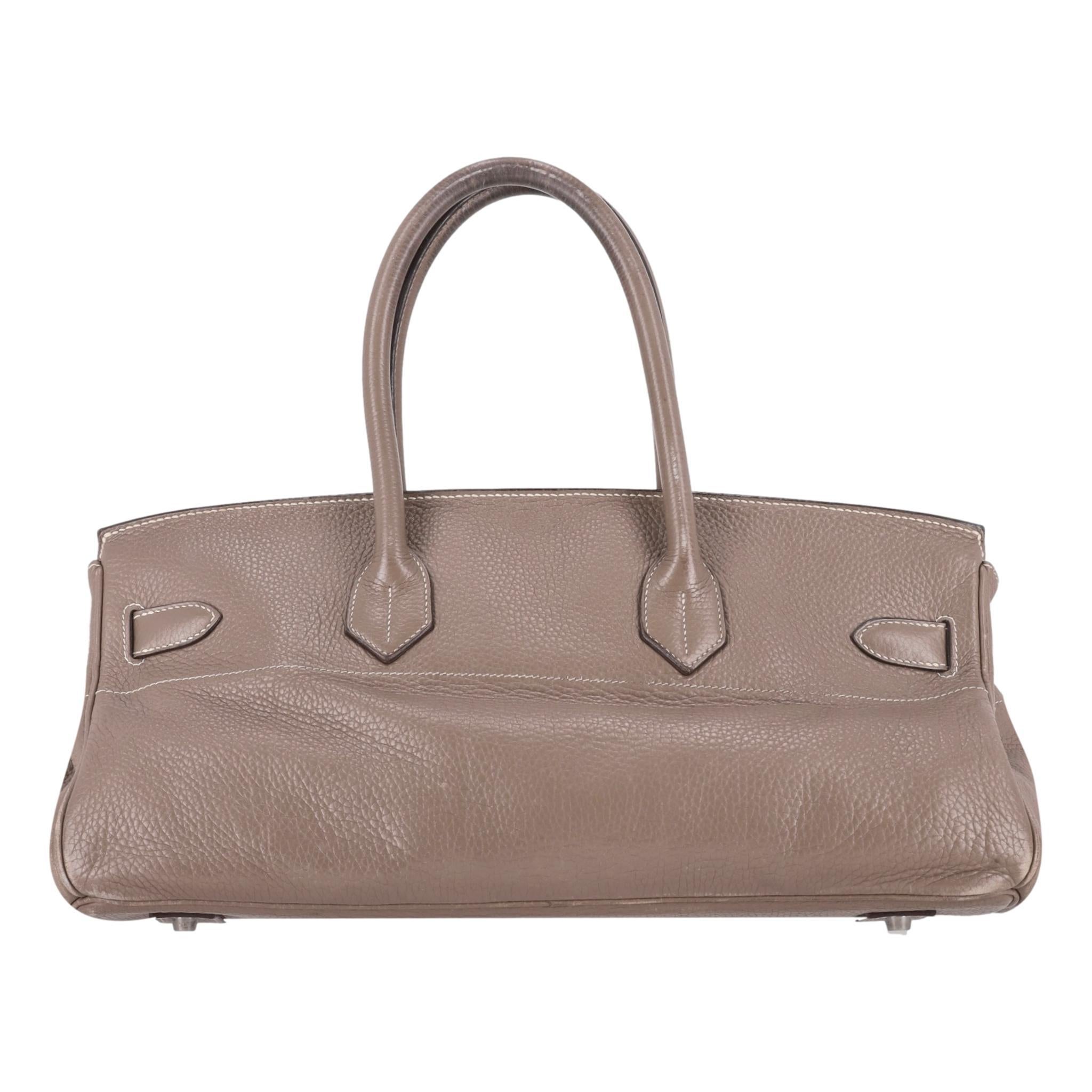 Hermes Jean Paul Gaultier Birkin 42cm Bag

Shoulder version of the iconic Birkin bag designed by Jean Paul Gaultier in Etoupe Clemence leather.

Featuring palladium hardware and Hermes' signature twist-lock closure.

Detailed with clochette,