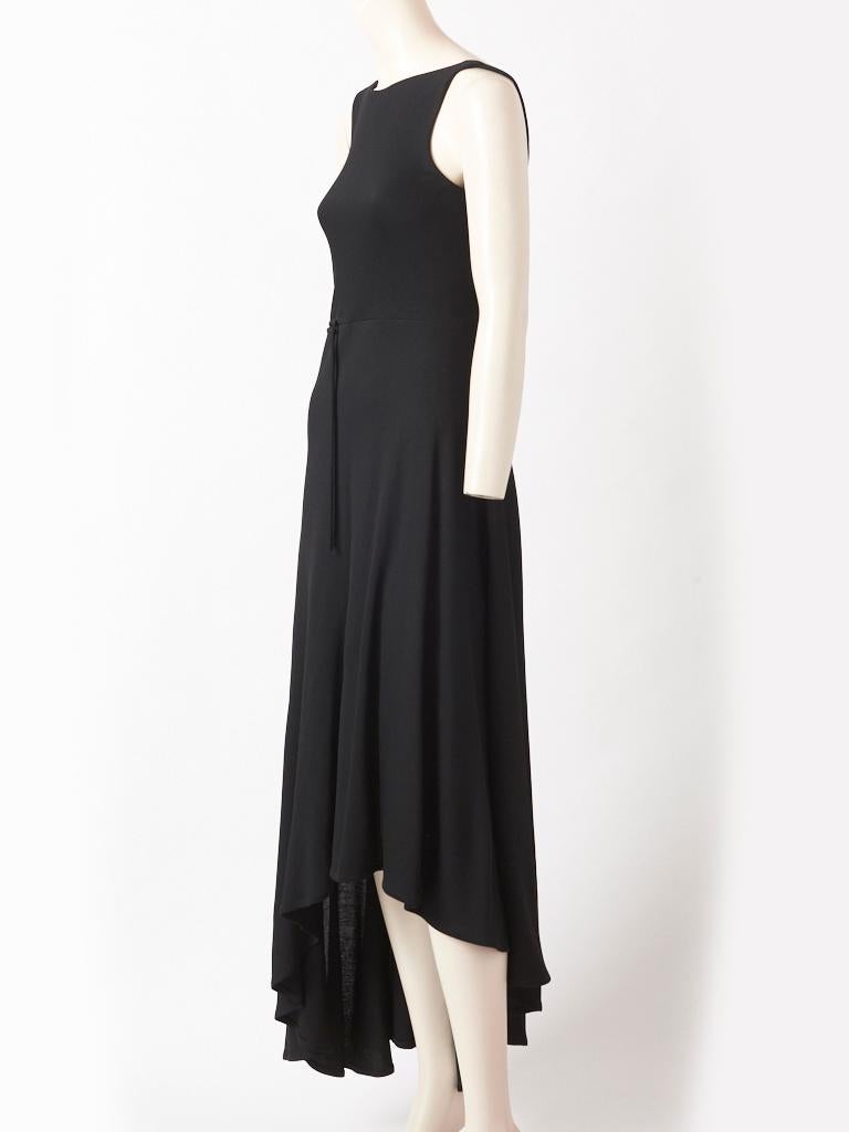  Hermès , black jersey , sleeveless dress, having a fitted bodice, u back, welting detail
at the waist and a paneled, asymmetrical hem.