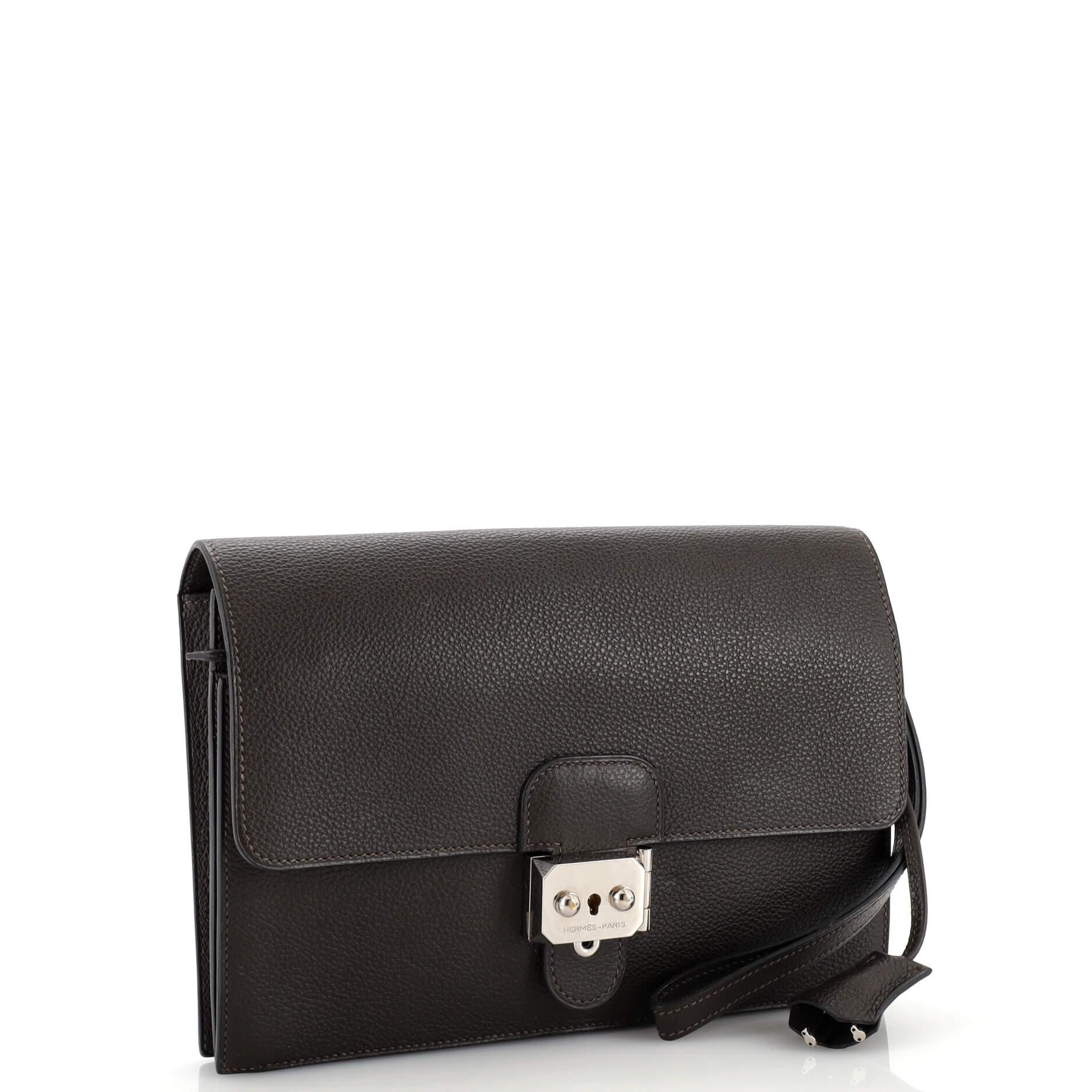 Condition: Very good. Creasing, minor wear and small marks on exterior and underneath flap, indentation on front due to closure hardware. Splitting on base and flap opening corner wax edges, marks in interior, scratches on hardware.
Accessories: