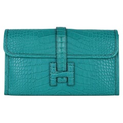 Hermès - Portefeuille/pochette Jige en alligator bleu paon mat, état neuf