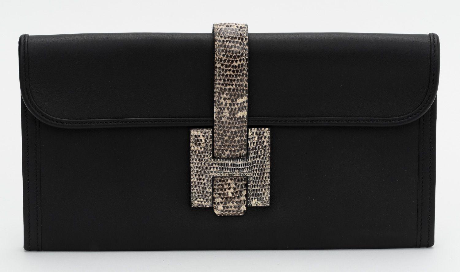 Hermès black leather 2020 Noir Swift Ombre Varanus Salvator Lizard Jige Elan Touch 29 clutch bag. The date stamp shows a D. The bag comes with the booklet and original box. No cites, does not ship internationally.