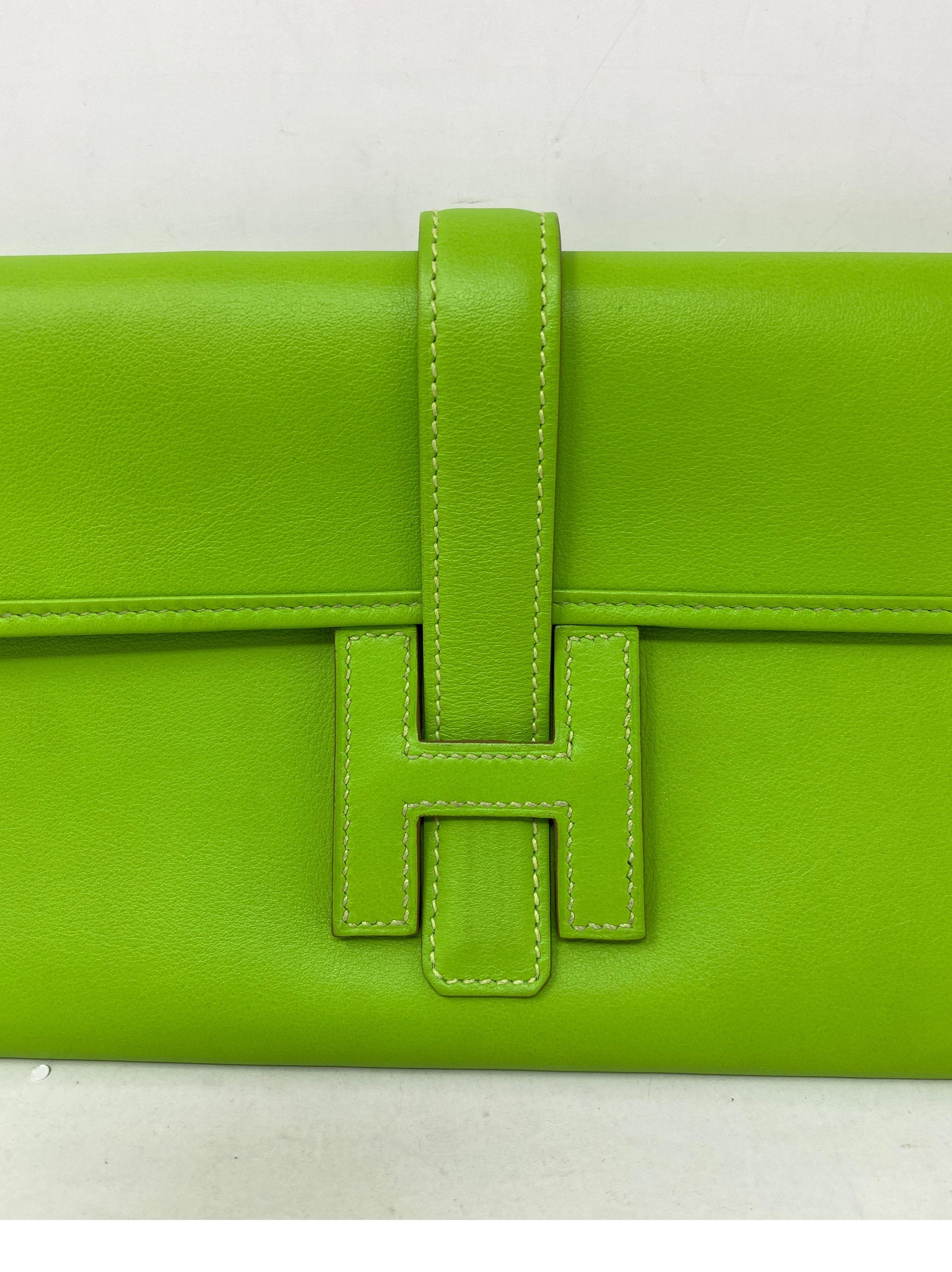 Hermes Lime Green Jige Clutch. Good condition. Bright lime green color. Guaranteed authentic. 