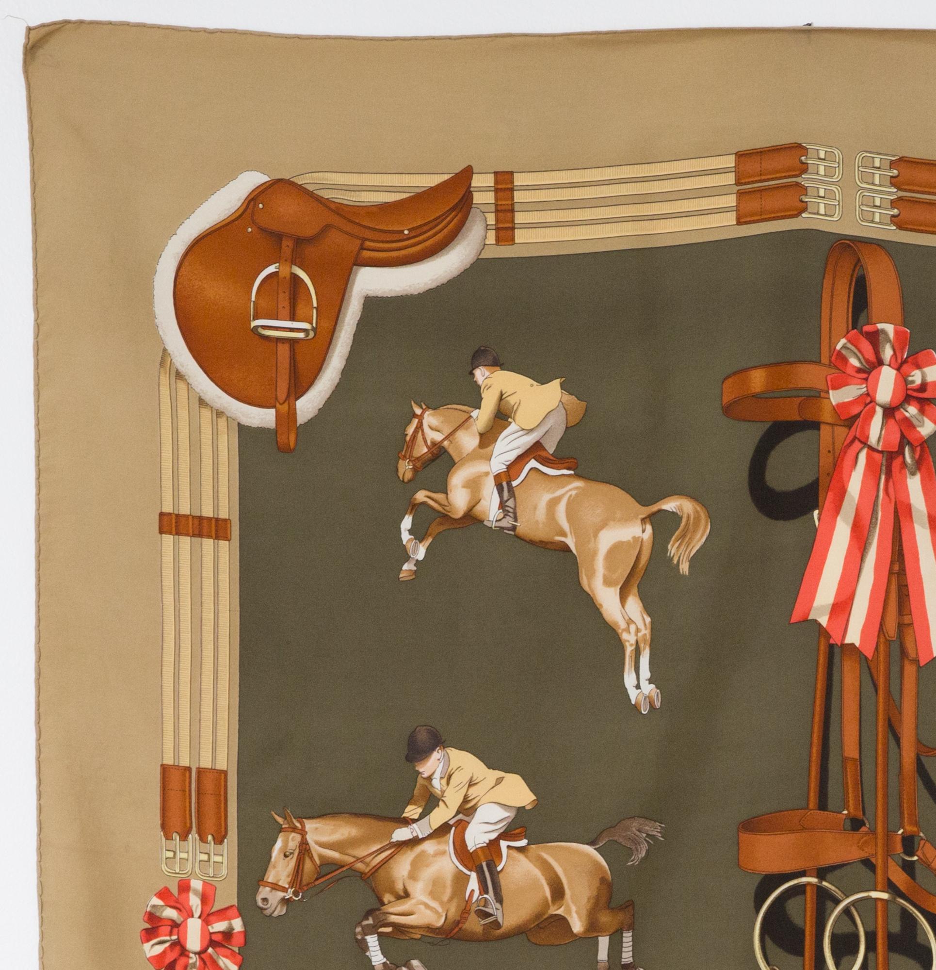 Hermes silk scarf Jumping by Philippe Ledoux featuring a camel border .
In good vintage condition. Made in France.
First edition 1971, then 1975
35,4in. (90cm)  X 35,4in. (90cm)
We guarantee you will receive this  iconic item as described and showed