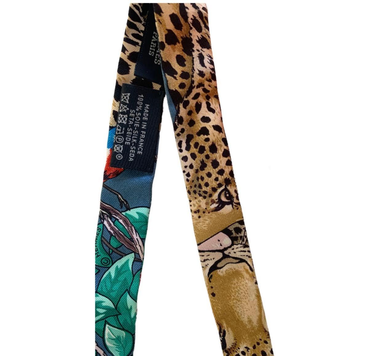Hermes Jungle Love Love Doll Twilly in silk. (100% silk).
Excellent Condition 
Original Box

A twilly in a mini version to wear as a ribbon in your hair or even tied around your wrist or neck, bringing a whimsical touch to your look!

Made in