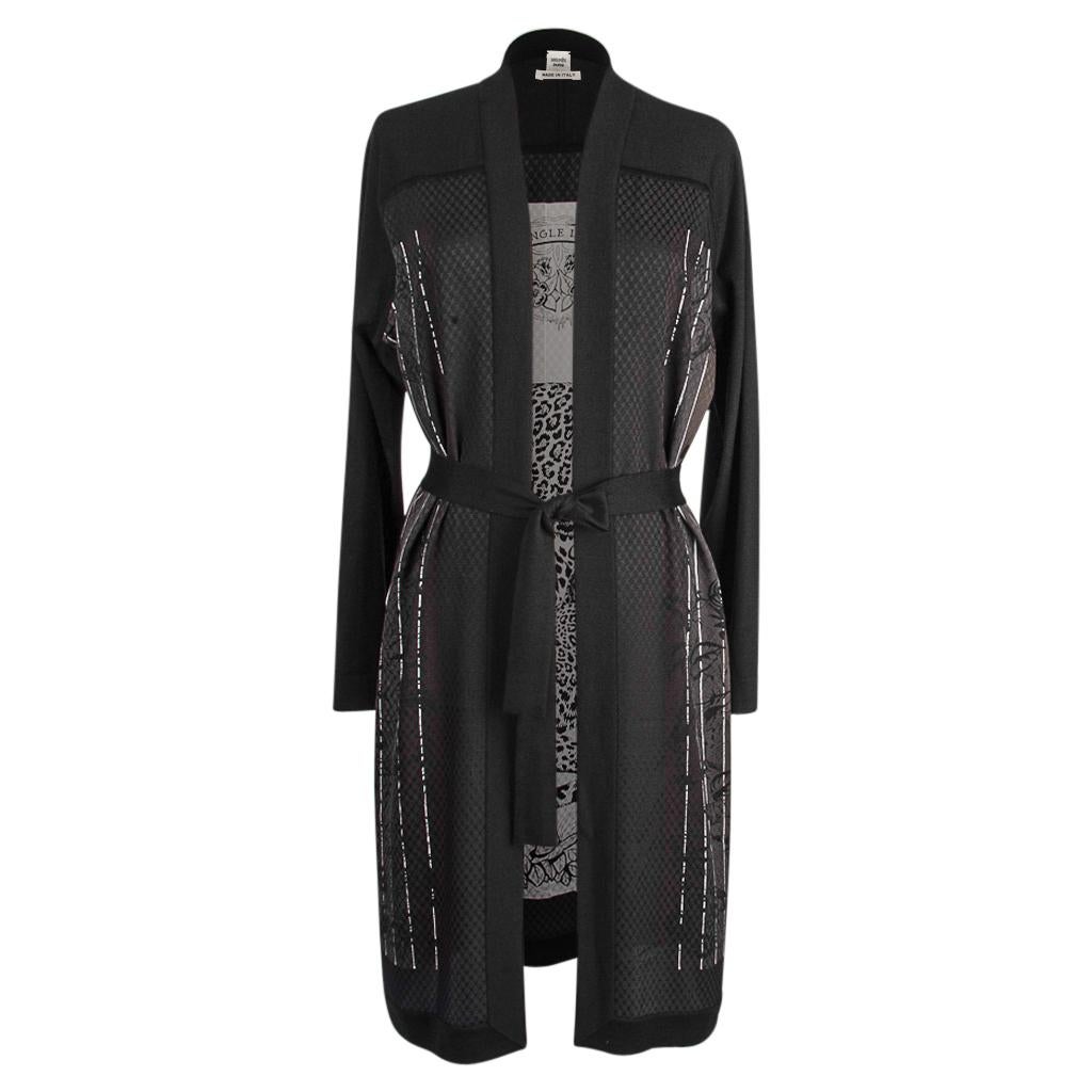 Mightychic offer an Hermes long twillaine Jungle Love Rainbow cardigan in Black and Gray.
Depicts the Jungle Love Rainbow scarf print in silk at rear and sides - Magnificent!
Sleeves and front are black cashmere.
Cardigan has knit belt.
Fabric is