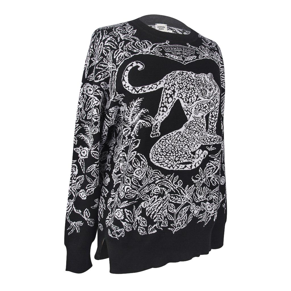 Guaranteed authentic Hermes Jungle Love Wide sweater featured in striking Black and White.
Cashmere and silk creates this iconic motif.
Sweater has ribbing at cuffs, hip and neck.
Drop shoulder for easy relaxed styling.
Fabric is 46% cashmere, 46%