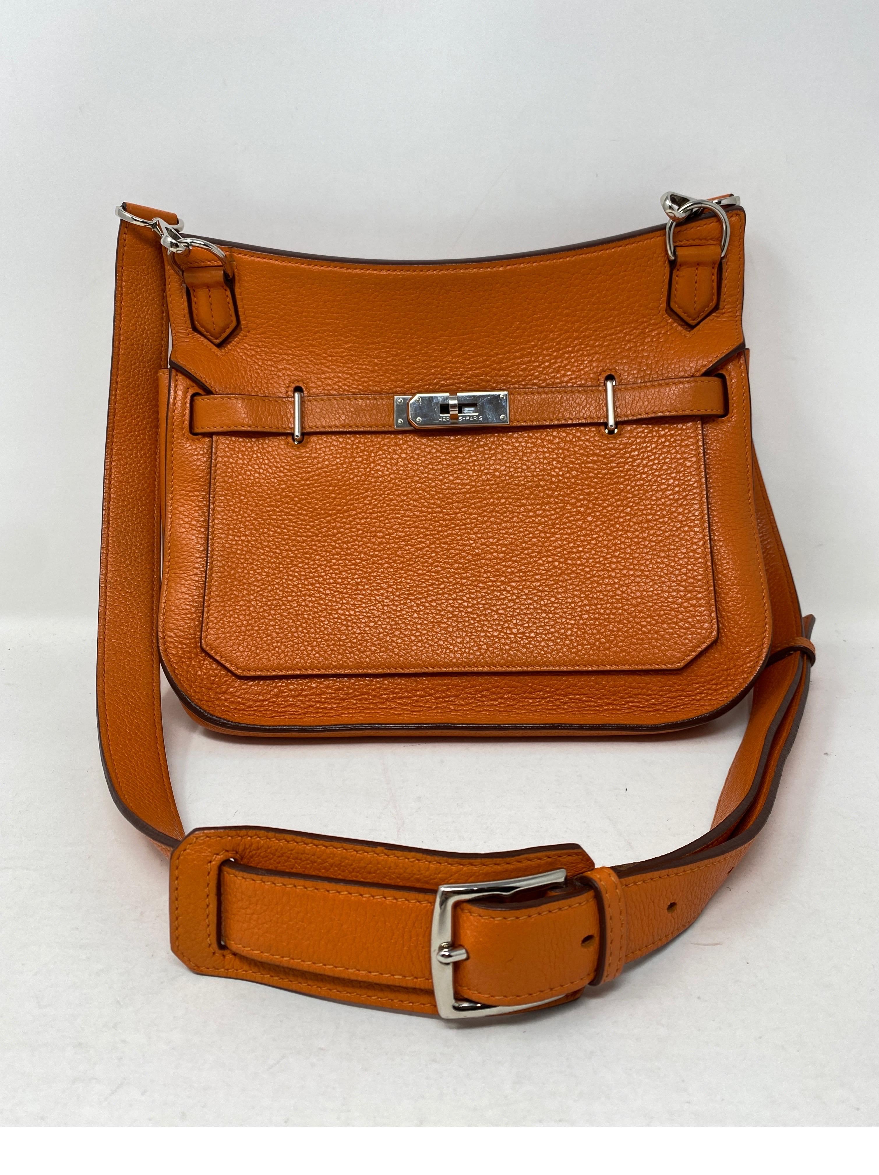 Hermes Jypsiere 28 Orange Crossbody Bag. Palladium hardware. Clemence leather. Good condition. Slight wear where silver handles rest on leather. Just on the straps. Great crossbody bag that has an adjustable strap. Includes dust cover. Guaranteed