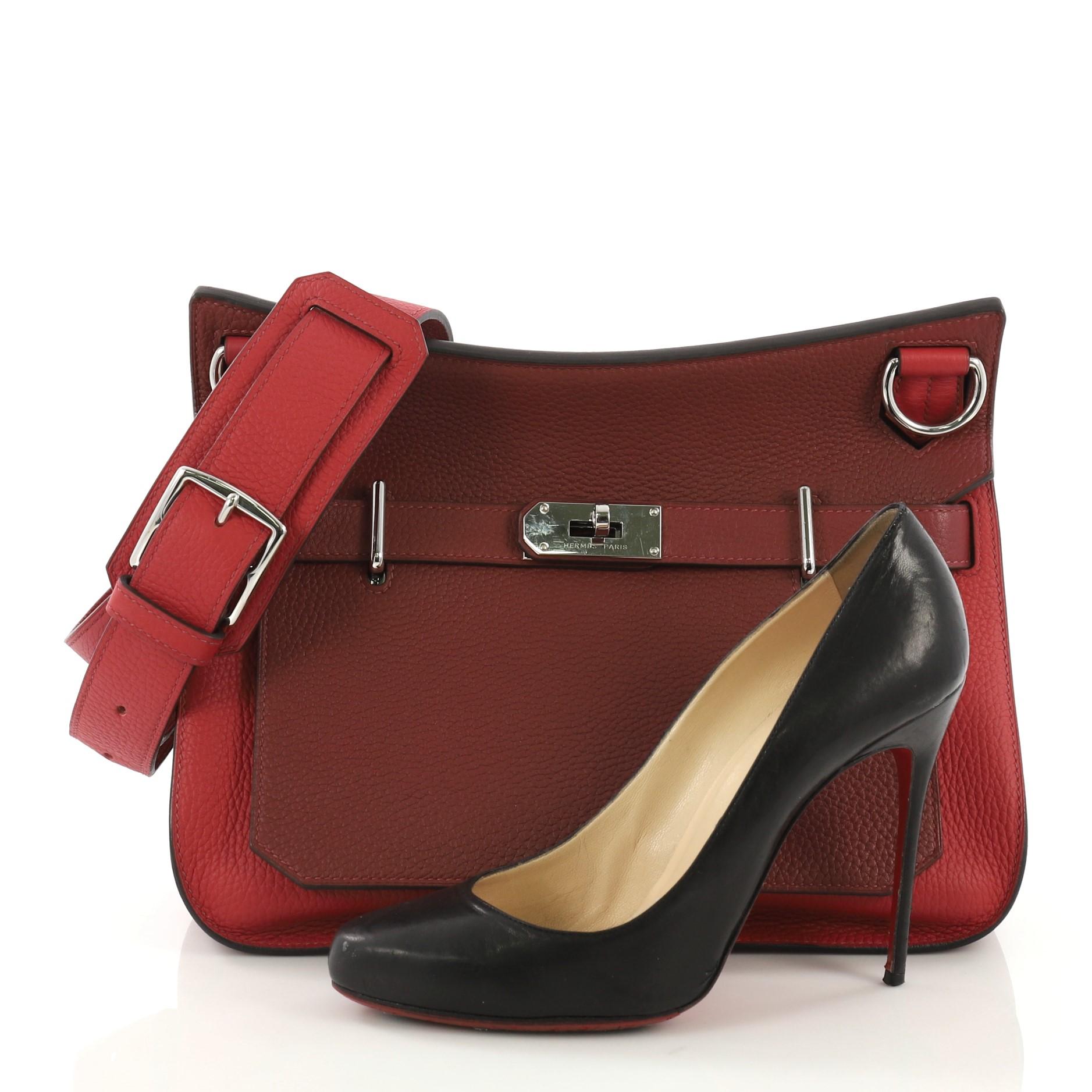 This Hermes Jypsiere 31, crafted in Rouge H and Rouge Casaque red Clemence leather, features a long adjustable strap and palladium hardware. Its front flap with the iconic Hermes turn-lock clasp closure opens to a Rouge H red chevre leather interior
