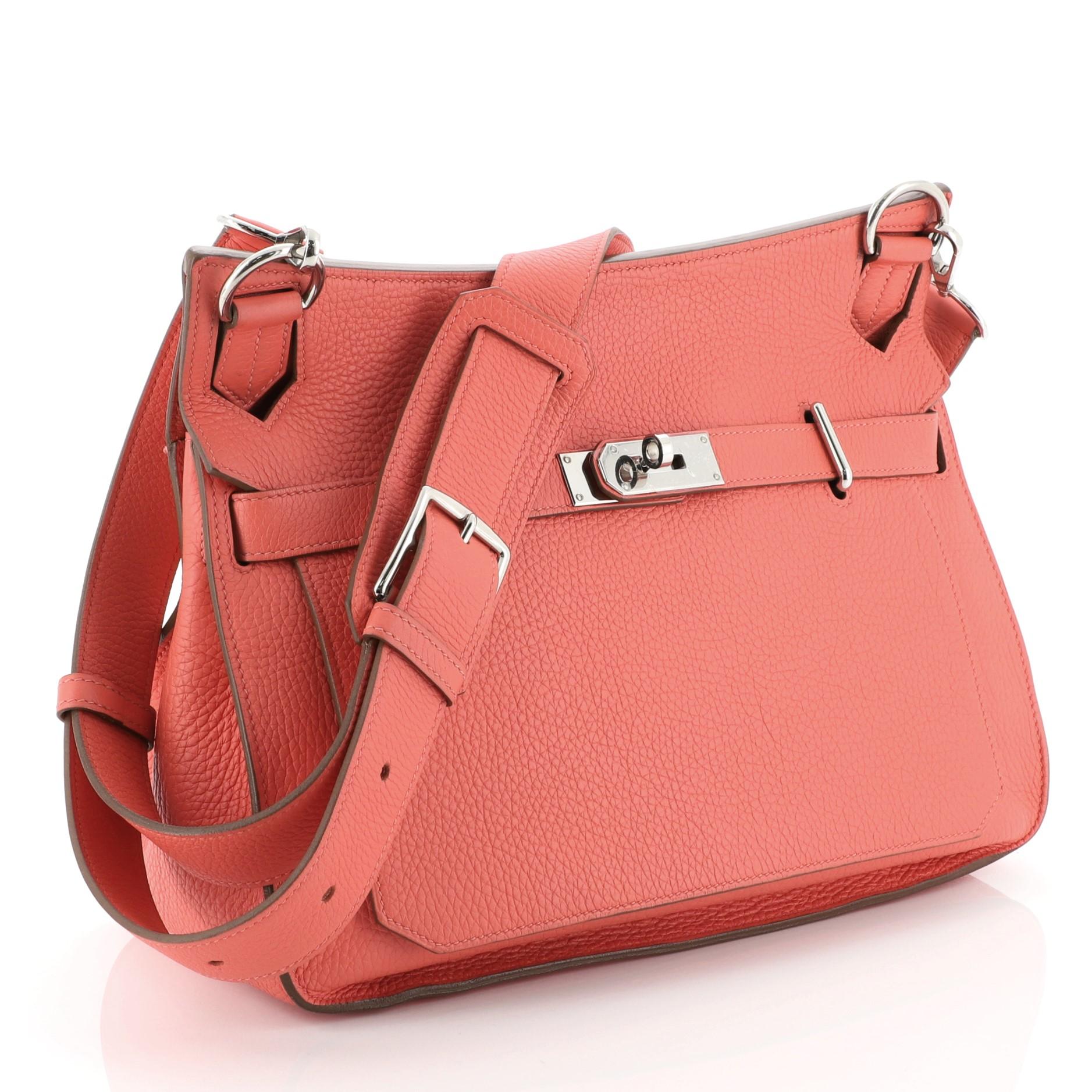 This Hermes Jypsiere Handbag Clemence 34, crafted in Rose Jaipur pink Clemence leather, features a long adjustable strap and palladium hardware. Its front flap with the turn-lock closure opens to a Rose Jaipur pink Chevre leather interior with slip