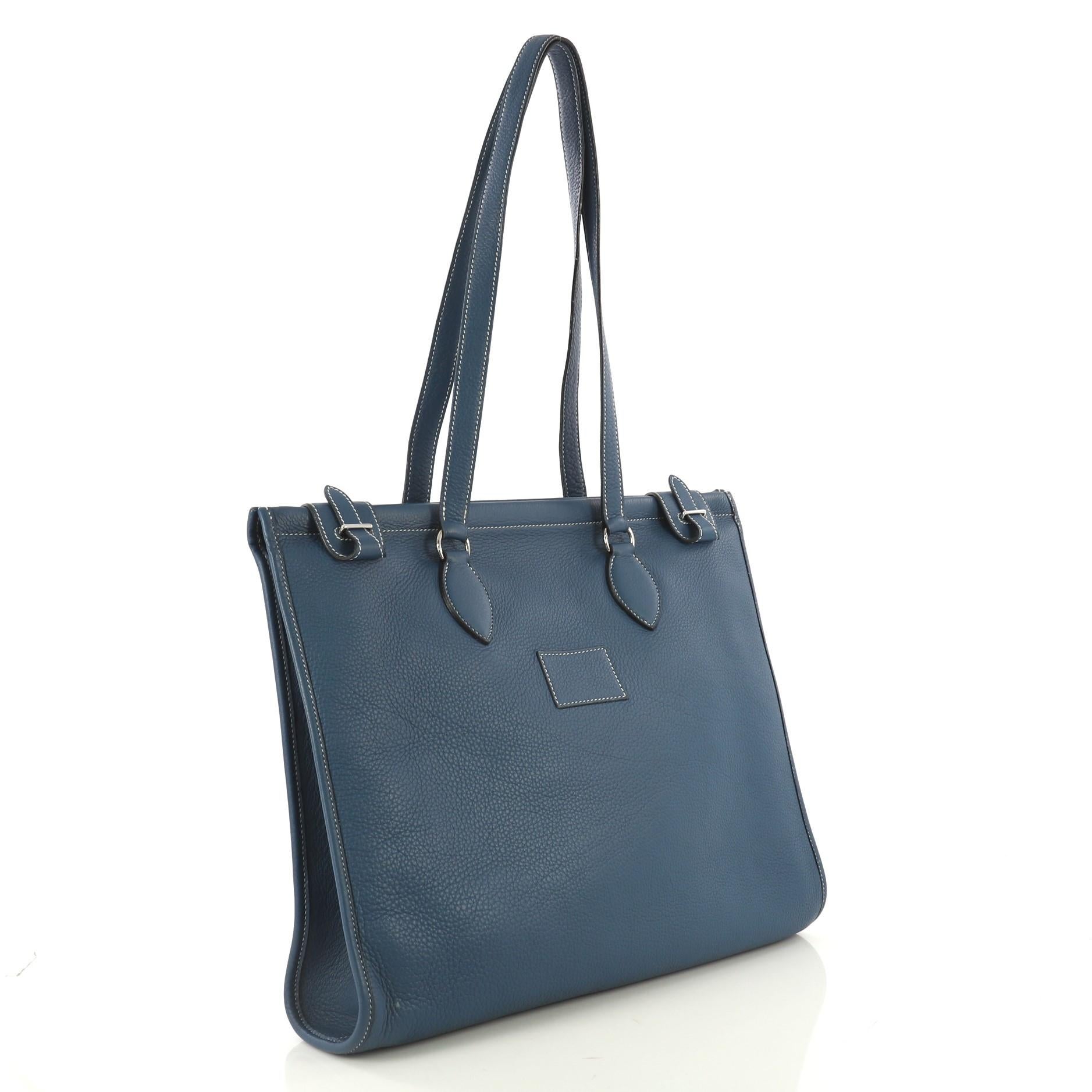 This Hermes Kaba Tote Leather 40, crafted from Bleu Thalassa blue clemence leather, features dual flat leather handles and palladium hardware. Its top buckle closure opens to a Bleu Thalassa blue raw leather interior. Date stamp reads: G Square