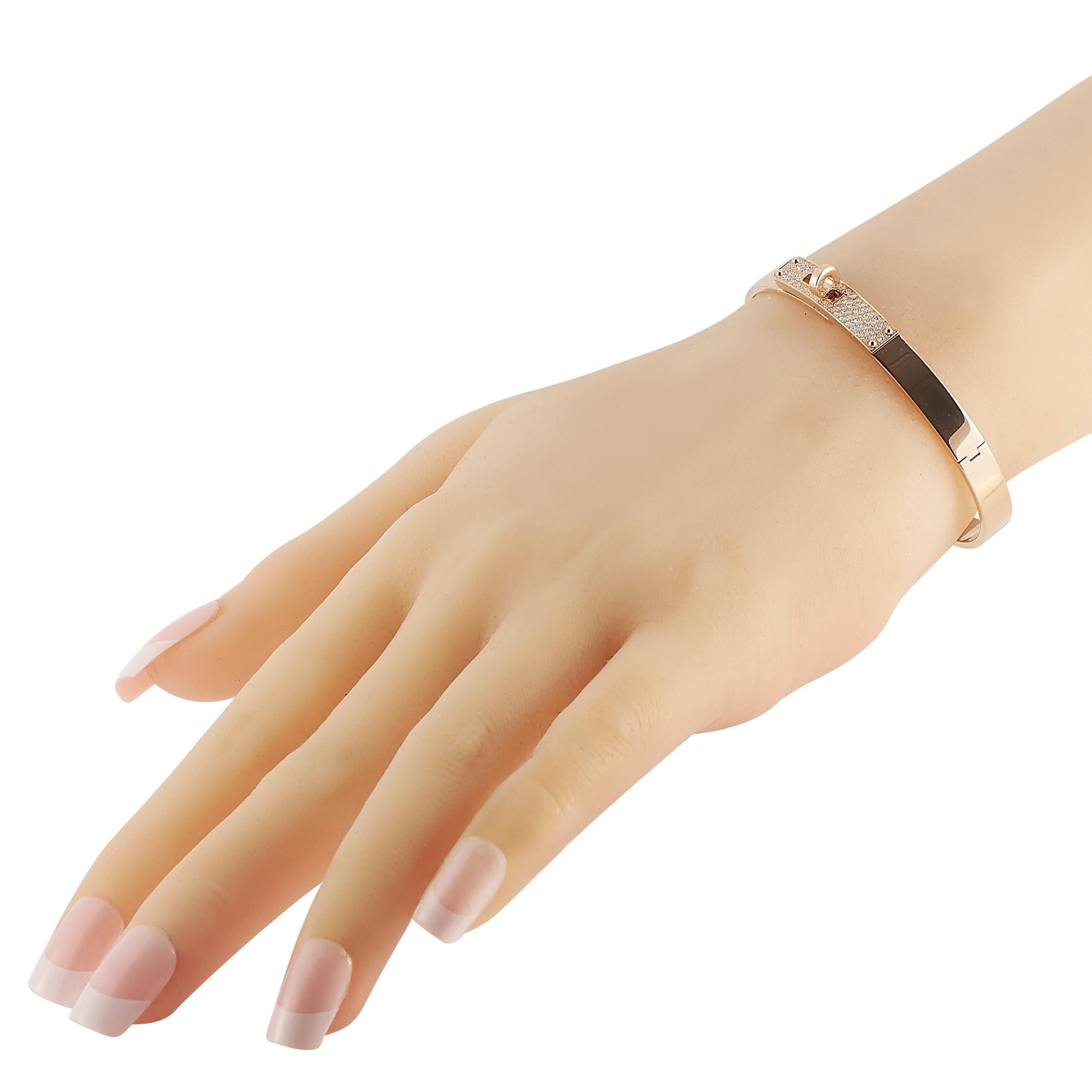 This Hermès Kelly Bangle is an instantly recognizable piece with an iconic sense of style. Measuring 7” long, this exquisite accent piece pairs opulent 18K Rose Gold with inset diamonds totaling 0.33 carats. 
 
 This jewelry piece is offered in