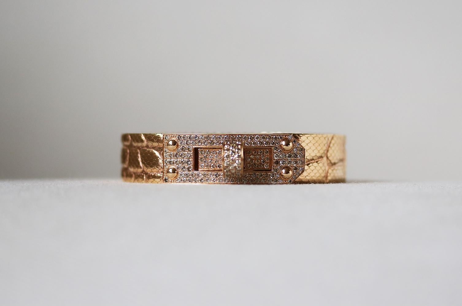 Hermès Kelly rose gold and diamond bracelet. A beautiful timeless piece is part of the iconic Kelly collection. Comprised of 18k Rose Gold. 1.86 Carats of pavé diamonds set on the bracelet's fastening. Milanese mesh alligator-style pattern strap.