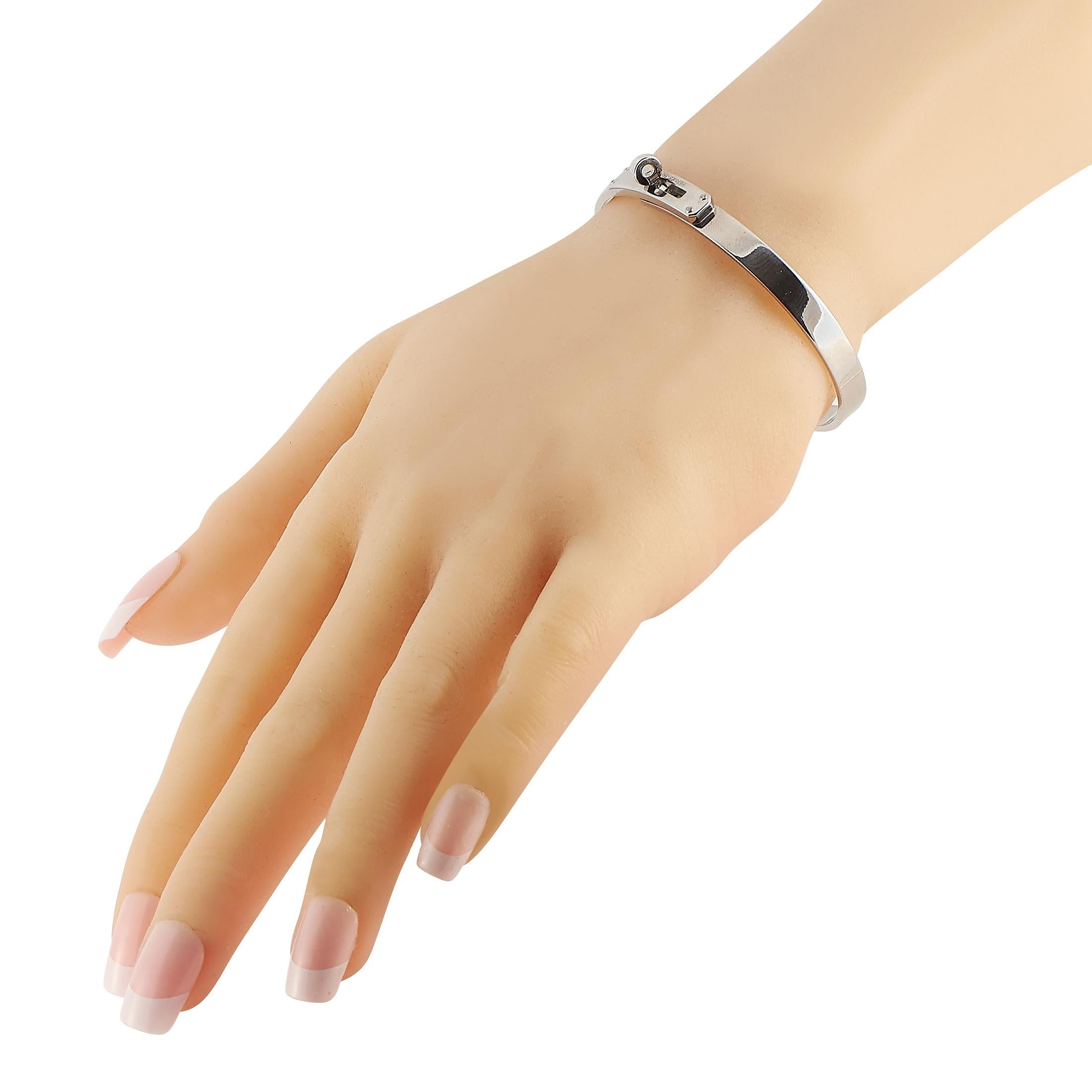This classic bracelet from the Hermes Kelly collection is nothing short of iconic. The collection’s signature turn-lock closure elegantly accents the center of this bangle bracelet, which measures 7.5” long and is made from 18K White Gold.

 This