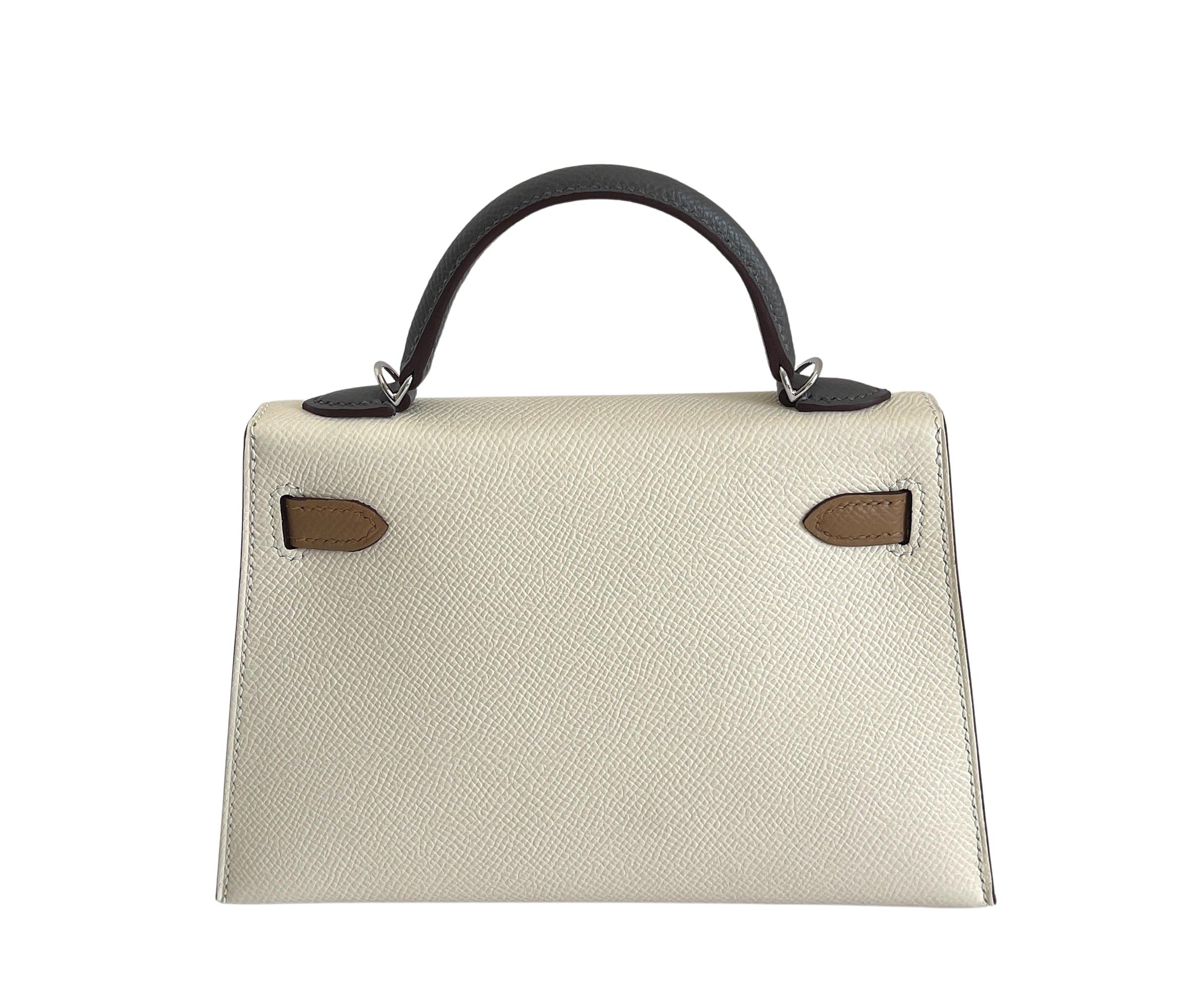 Hermes
Called the Mini Kelly
20cm 
This Kelly, in the Sellier style, is in Nata Gris Meyer and Chi epsom leather with palladium hardware and has tonal stitching, two straps with front toggle closure, single rolled handle and removable shoulder