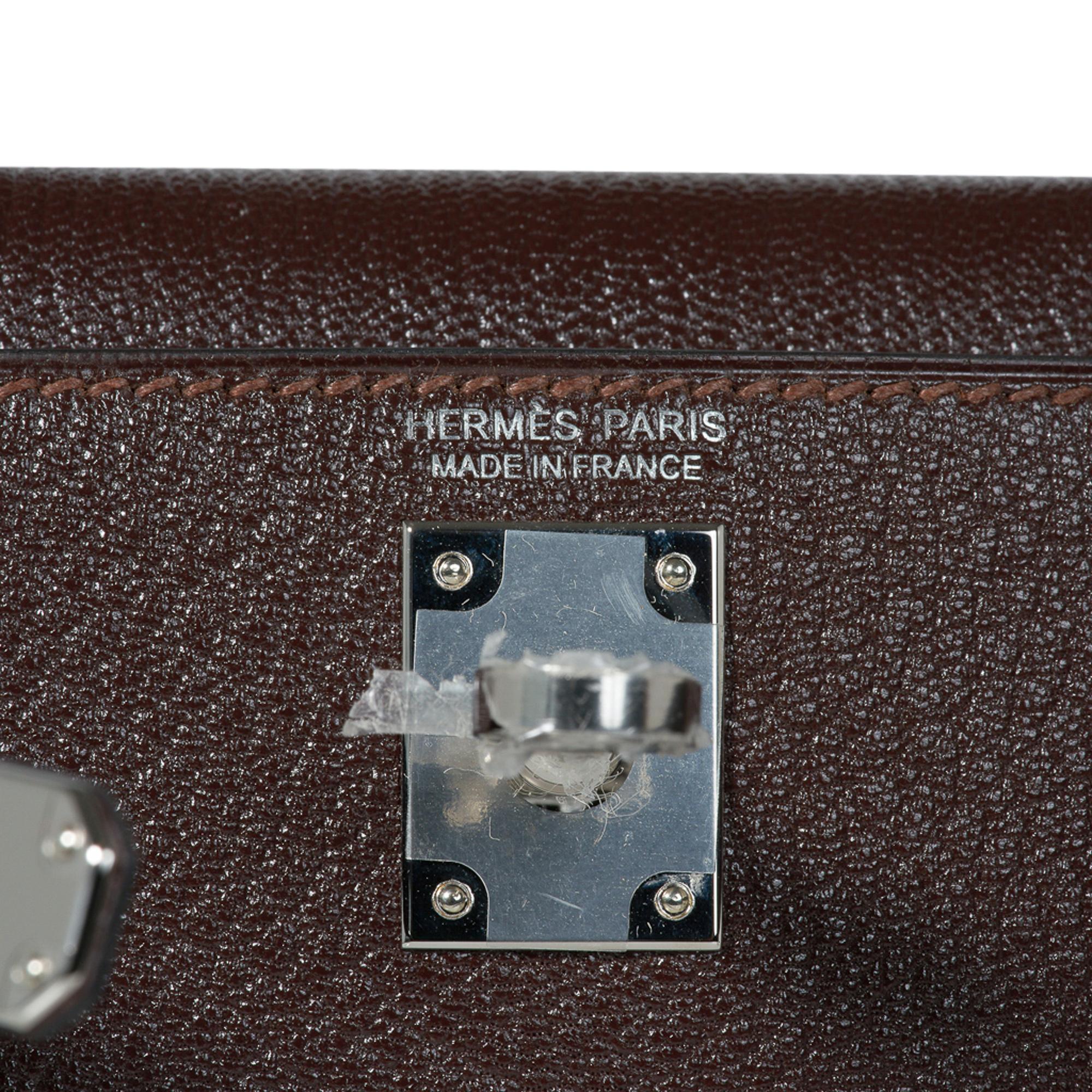 Guaranteed authentic Hermes Kelly 20 Bi-Color Mini Sellier bag featured in rich Havane with Etrusque interior. 
Chevre leather accentuated with Palladium hardware.
Comes with signature Hermes box, shoulder strap, and sleeper.
The Kelly 20 bag  is