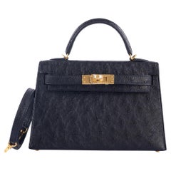 Hermès Kelly 20 Mini II Sellier Negro Avestruz Herrajes Dorados