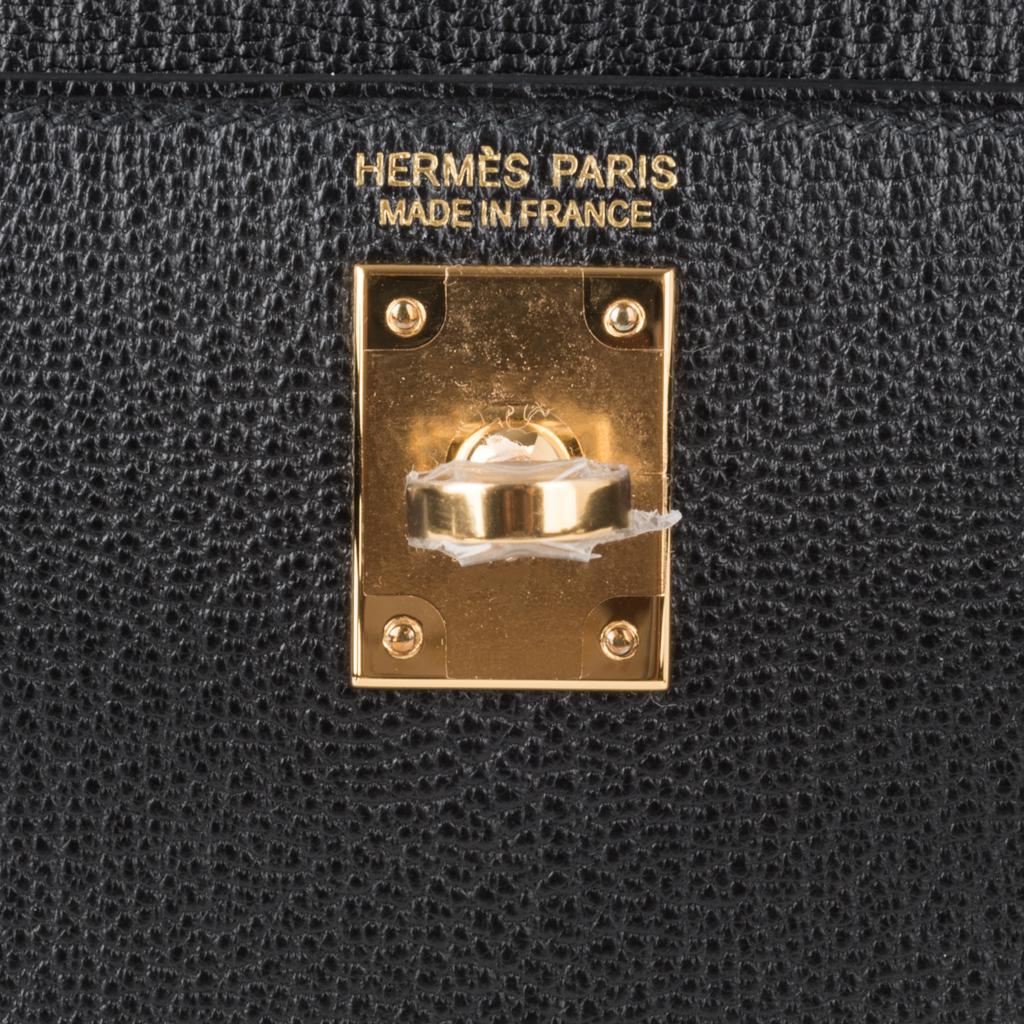 Guaranteed authentic Hermes Kelly 20 Mini ll Sellier features black chevre leather.
Lush with coveted gold hardware.
Carry by hand, shoulder or cross body.
Divine size for day to evening. 
Comes with signature Hermes box, shoulder strap, and 