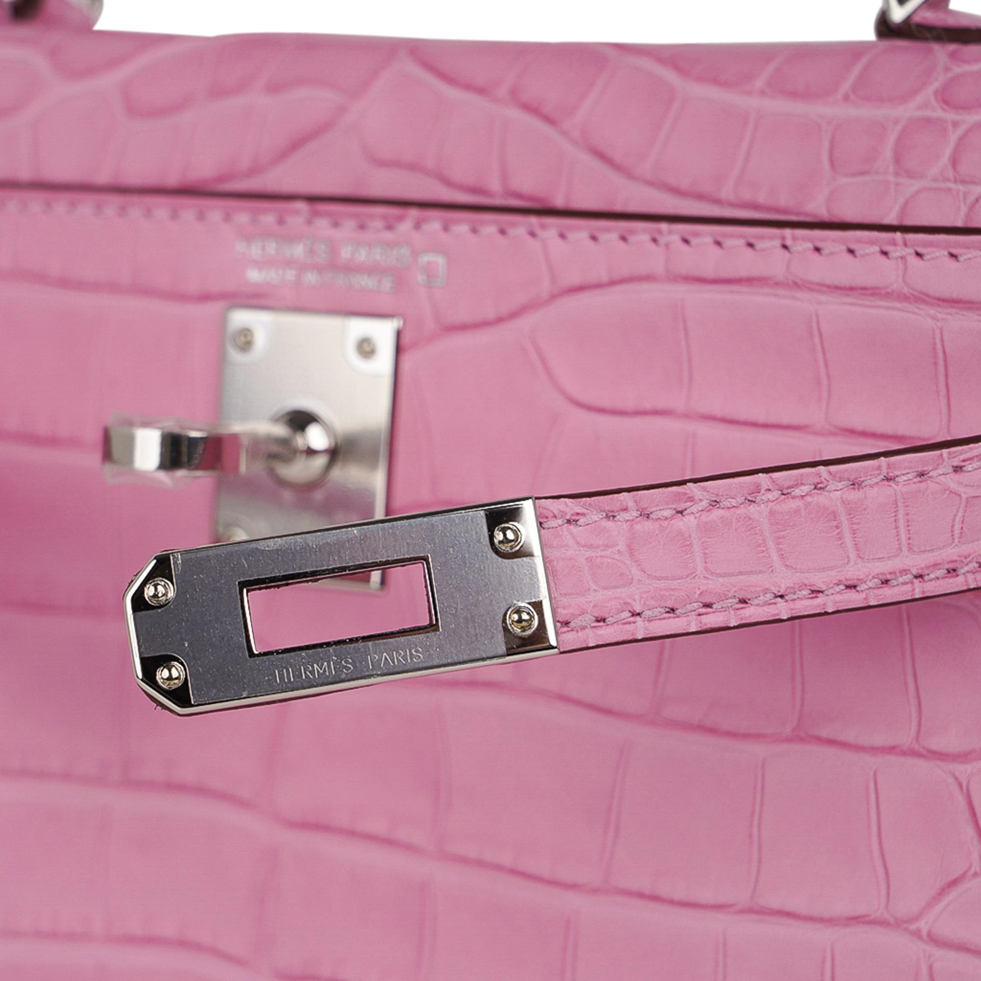 Mightychic offers a guaranteed authentic Limited Edition Hermes Kelly 20 Mini Sellier bag featured 
in coveted unircorn 5P Pink matte Alligator.
Fresh with palladium hardware.
The Kelly 20 bag in alligator is extremely limited and difficult to