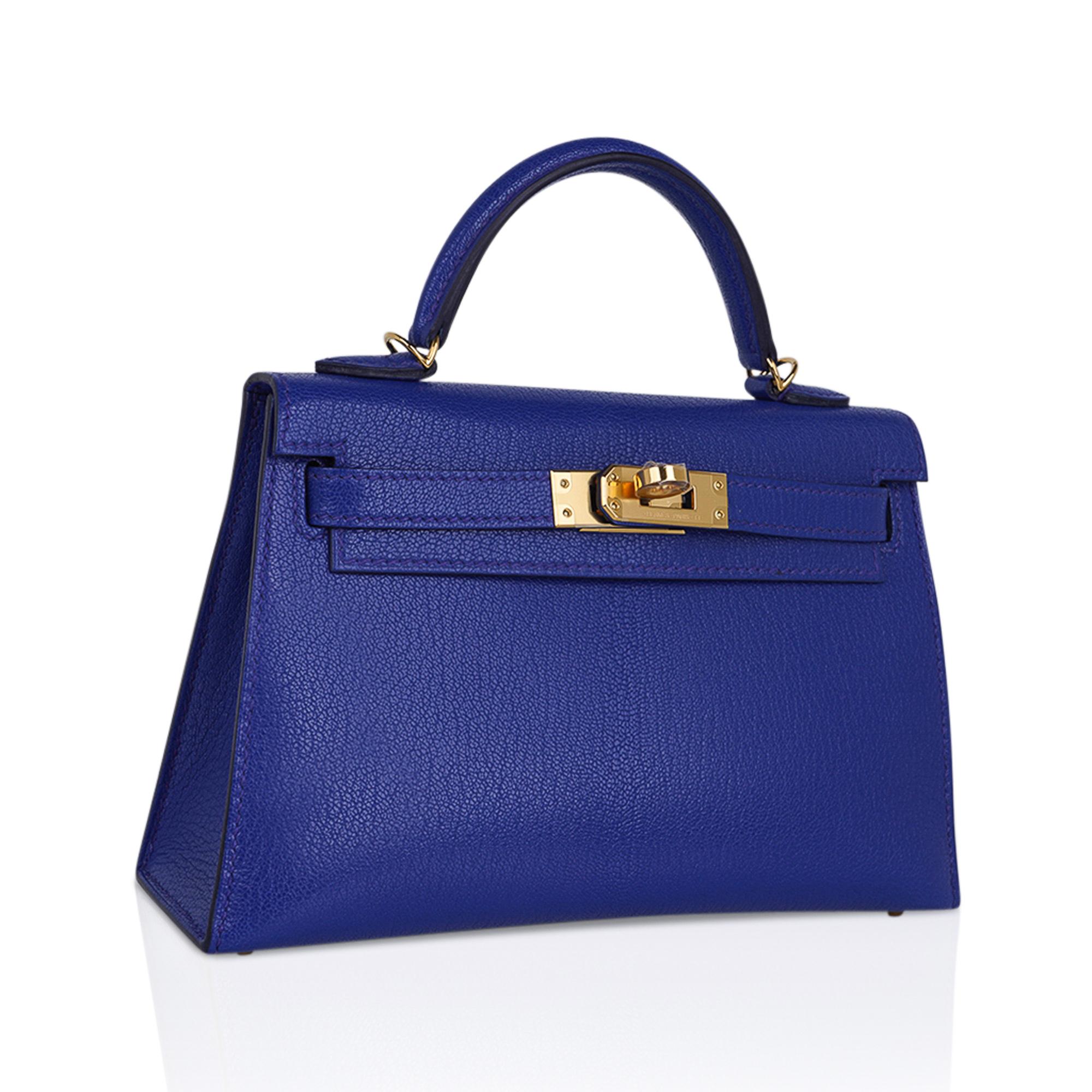 Mightychic offers an Hermes Kelly 20 Mini Sellier bag featured in vibrant richly saturated Bleu de Royal.  
Hermes Blue de Royal is a vibrant jewel toned blue which is gorgeous for year round wear, and completely neutral.
Chevre leather accentuated