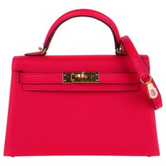 Sac Hermès Kelly 20 Mini Sellier rose extrême cuir Epsom finitions métalliques dorées