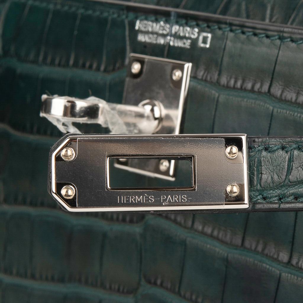 Guaranteed authentic Hermes Kelly 20 Mini Sellier features Vert Cypress Alligator. 
Fresh with Palladium hardware.
Carry by hand, shoulder or cross body.
The Kelly 20 bag in alligator is extremely limited and difficult to procure. 
Comes with
