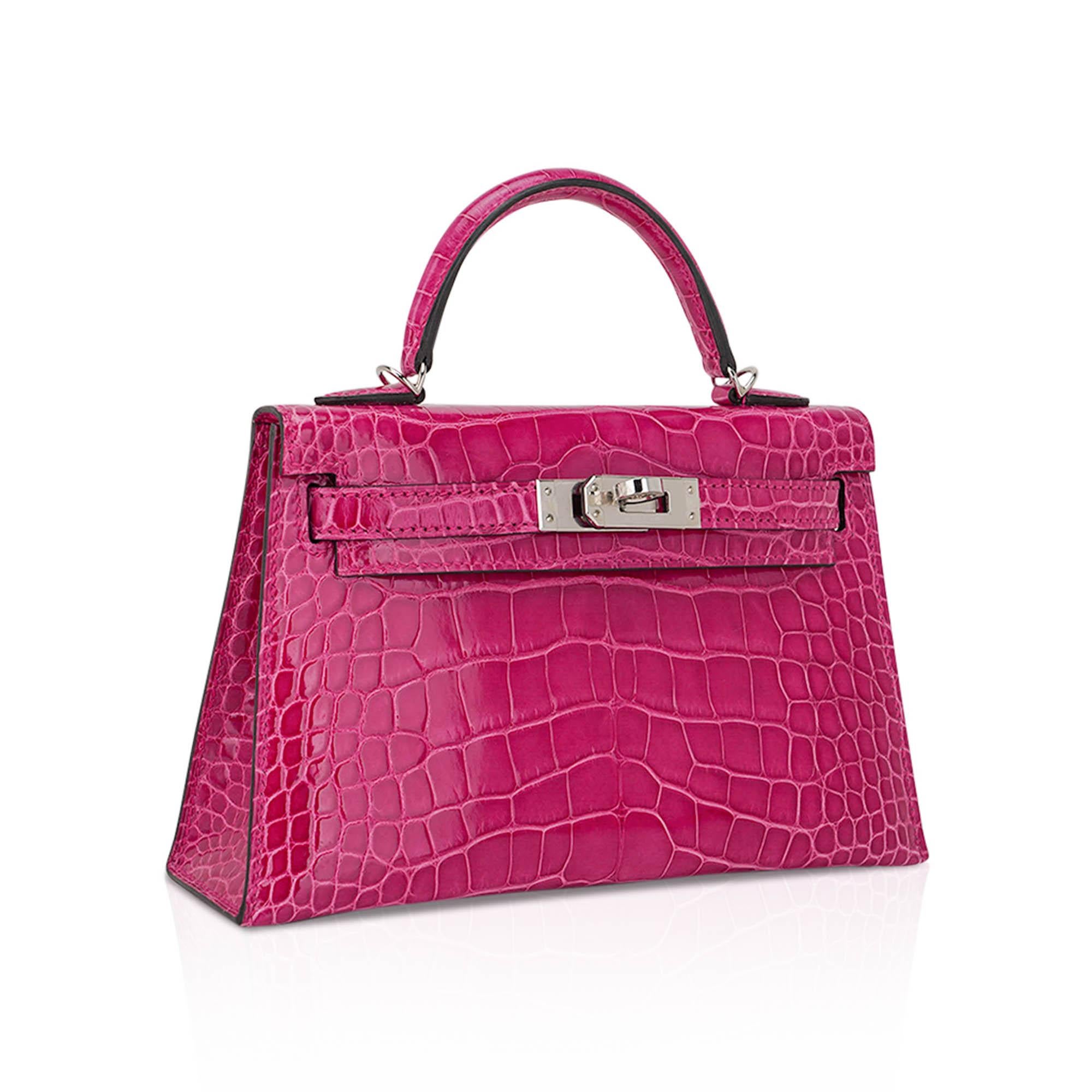 Mightychic offers a Limited Edition Hermes Kelly 20 Sellier bag featured in stunning Rose Scheherazade alligator.
Accentuated with crisp with palladium hardware.
Timeless and highly coveted this exquisite vivid jewel tone pink mini Hermes Kelly bag