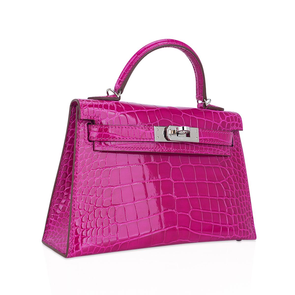 Mightychic offers a Limited Edition Hermes Kelly 20 Sellier bag featured in stunning Rose Scheherazade alligator.
Accentuated with crisp with palladium hardware.
Timeless and highly coveted this exquisite vivid jewel tone pink mini Hermes Kelly bag