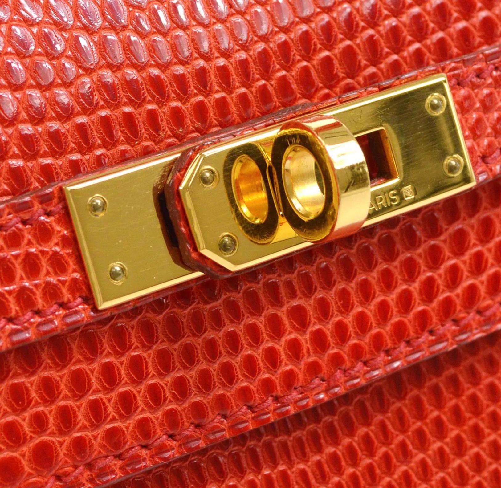 Pre-Owned Vintage Condition
From 1999 Collection
Rouge VIF
Lizard Leather
Gold Tone Hardware
Leather Lining 
Measures 8