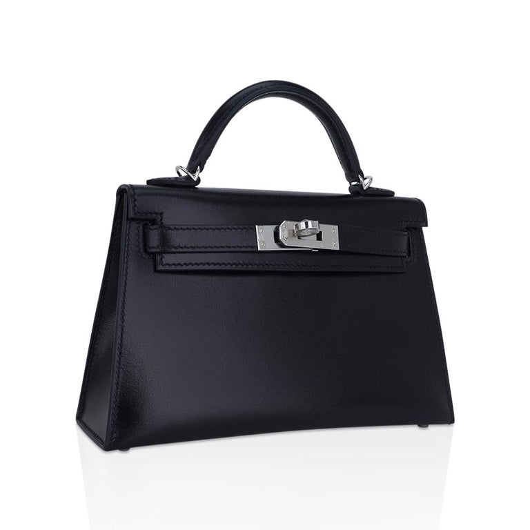 Mightychic offers an Hermes Kelly 20 Mini sellier bag featured in rare, coveted Black Box leather.
Small bags are the story and none is better than the Hermes Kelly Sellier 20 bag.
This sophisticated Hermes Kelly 20 Black bag is accentuated with