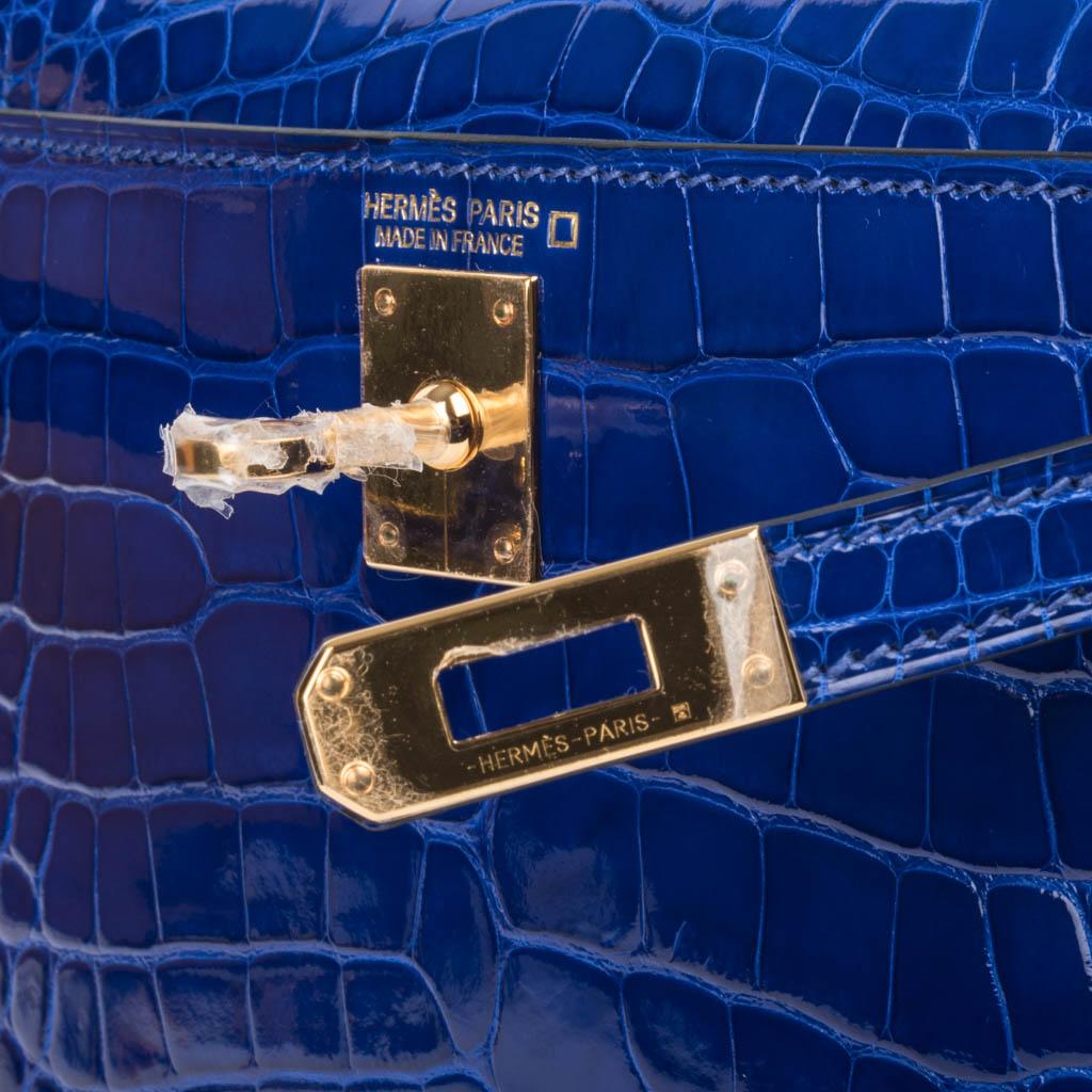 Guaranteed authentic Hermes Kelly Sellier 20 features vivid Electric Blue Alligator.
Rich with gold hardware.
Carry by hand, shoulder or cross body.
Divine size for day to evening. 
Comes with signature Hermes box, shoulder strap, and sleepers.
NEW
