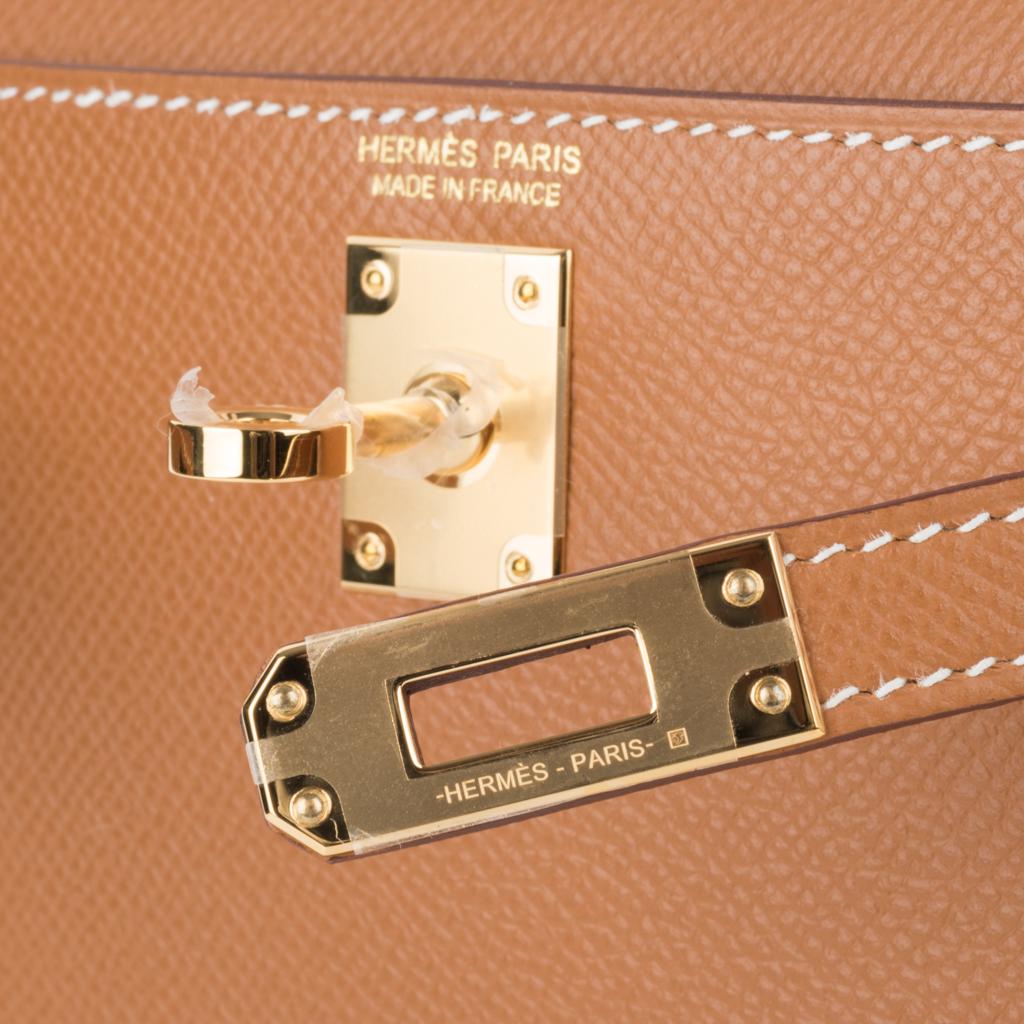 Guaranteed authentic Hermes Kelly 20 Sellier bag.
Coveted and rare to find classic Gold Epsom leather with gold hardware.
Carry by hand, shoulder or cross body.
Divine size for day to evening. 
Comes with signature Hermes box, shoulder strap, and