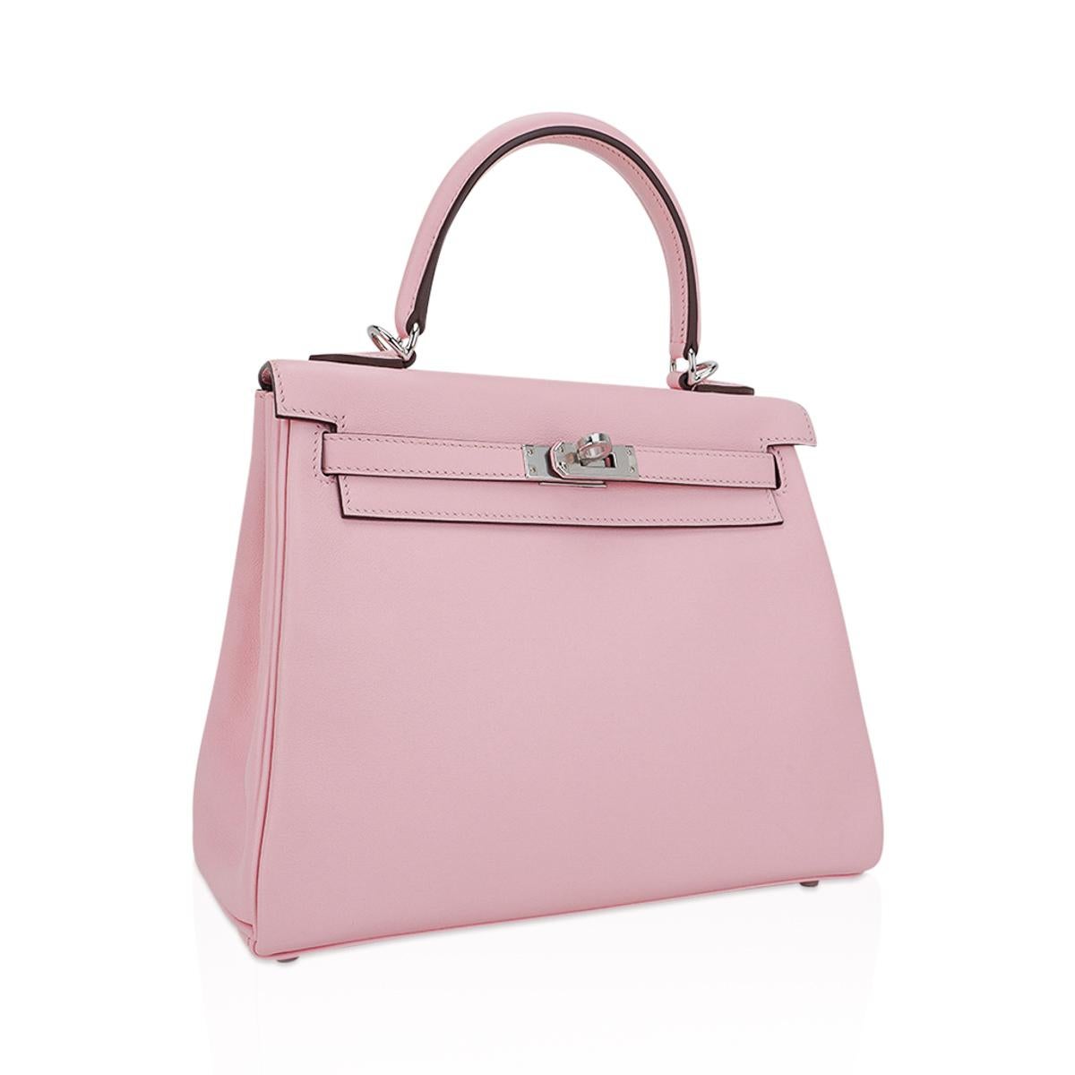 Mightychic offers an Hermes Kelly 25 bag featured in beloved Rose Sakura.
This gorgeous most pale of the Hermes Pink family is gentle Cherry Blossom.
A chic and stylish authentic Hermes Kelly bag in Swift Hermes leather with fresh Palladium