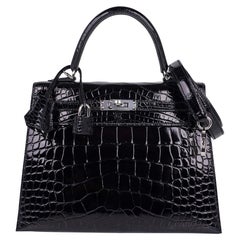 Sac Hermès Kelly 25 Sellier noir en alligator avec finitions métalliques en palladium