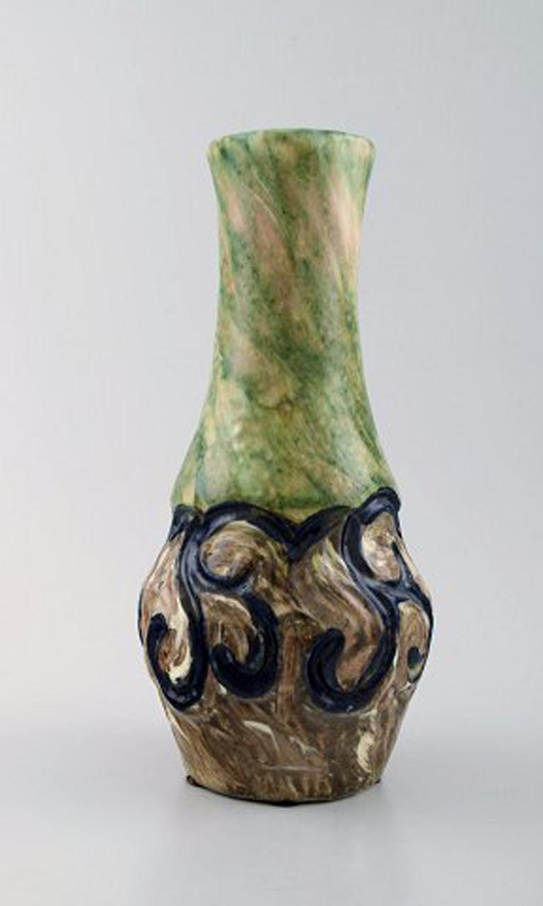 Møller & Bøgely, Art Nouveau large ceramic vase of glazed ceramics, circa 1920s.
Large Danish private collection of Møller & Bøgely ceramics in stock.
Measures: 22 cm x 10.5 cm.
In perfect condition.
