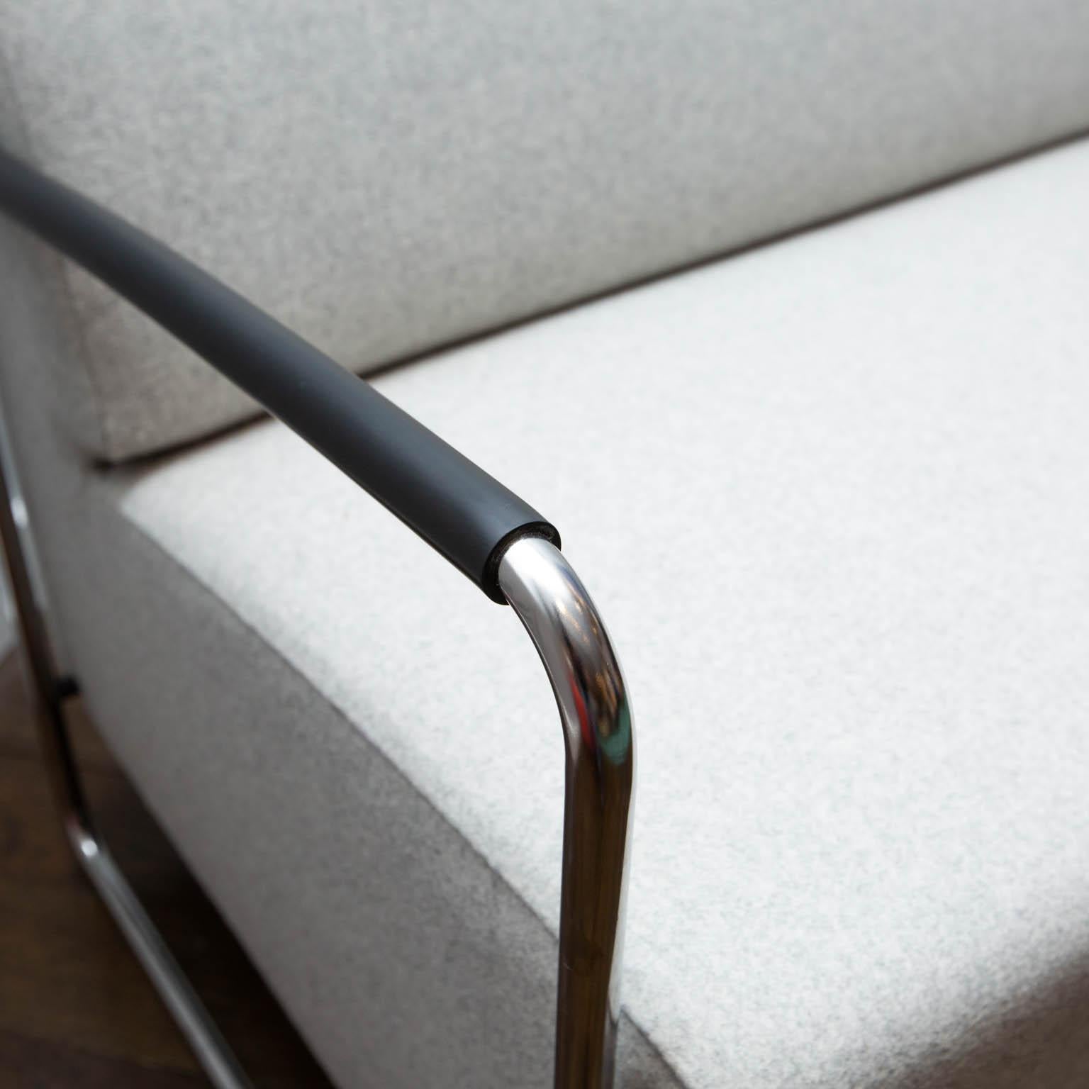 Designed by Norbert Novotny for Swiss furniture maker Dietiker. This new/old stock sofa is finished in light grey Kvadrat wool. It features tubular chrome arms with rubber armrests.