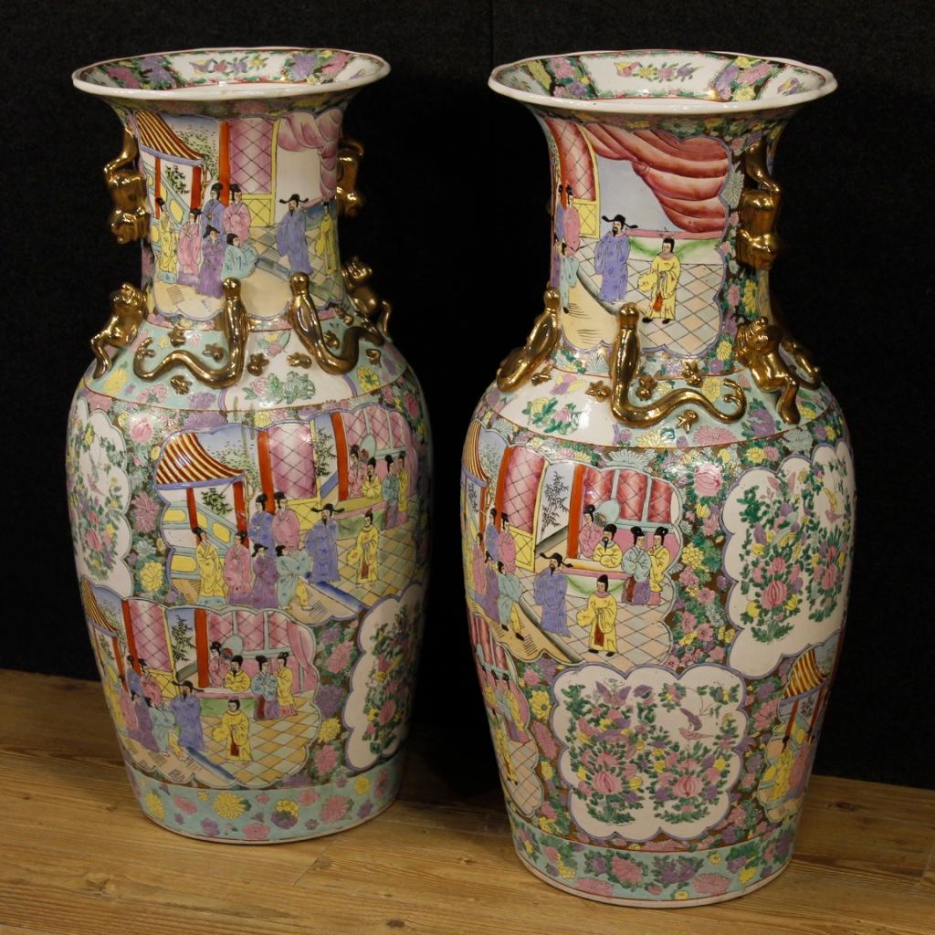 Pair of 20th century Chinese vases. Objects in gilded, chiselled and hand-painted ceramic with oriental scenes with characters. Vases of exceptional size and impact for antique dealers and collectors. Items stamped under the base (see photo). In