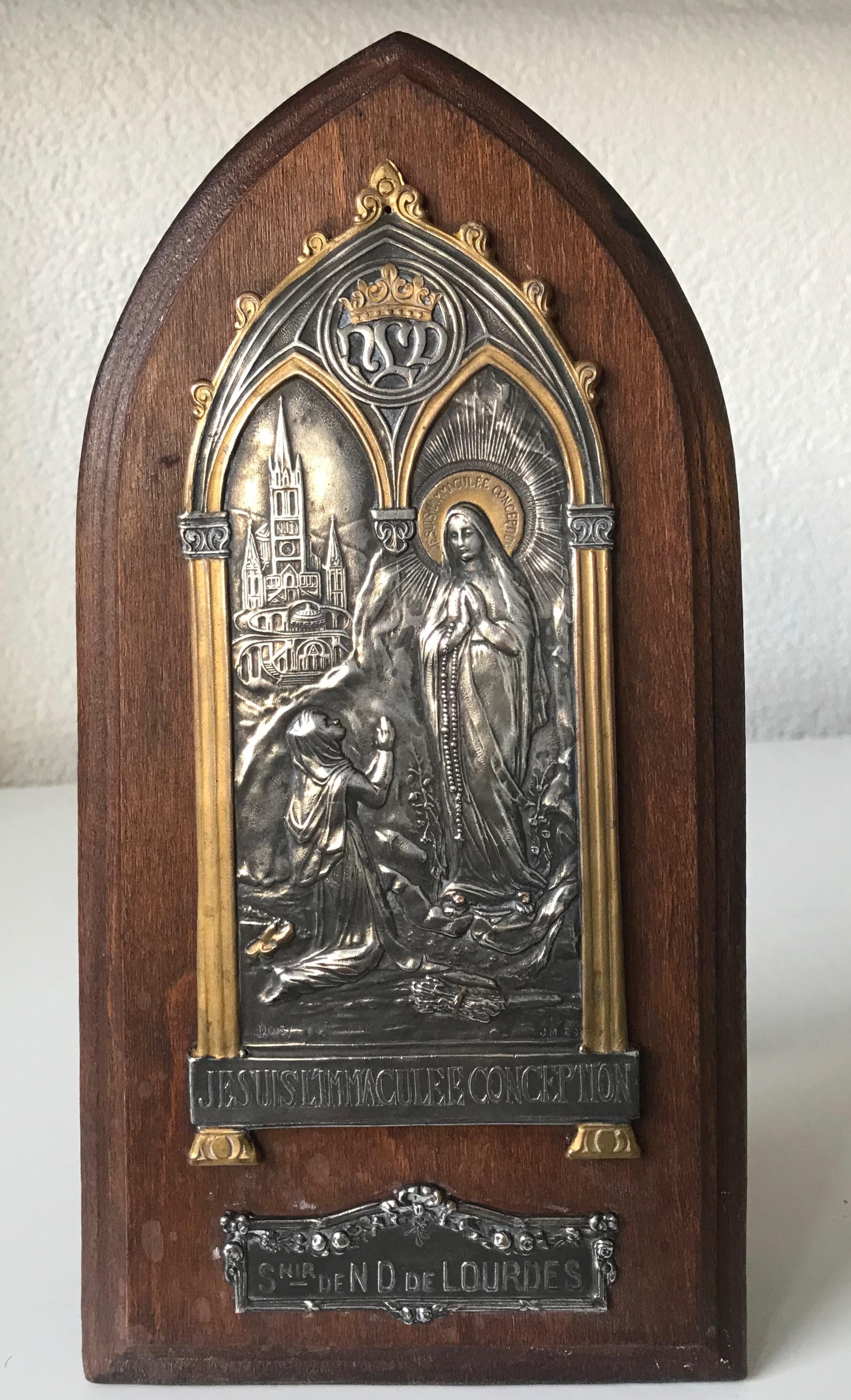 Early 1900, Gothic Revival signed plaque of 'Notre Dame de Lourdes' with musical movement.

Notre Dame de Lourdes is French for 