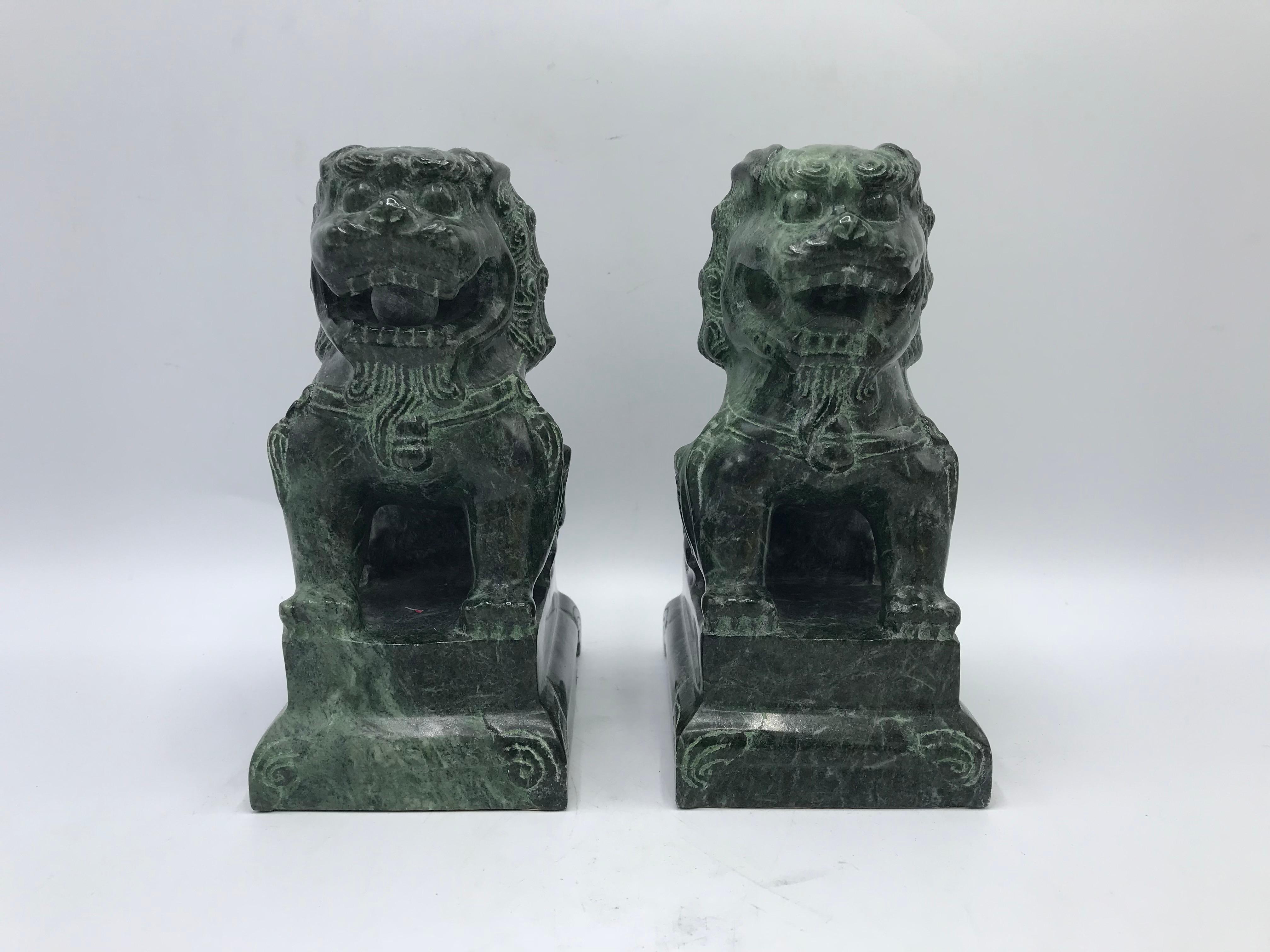 Offered is an exquisite, pair of 1960s solid-marble foo dog sculptures. Stunning details. The pair would make for beautiful bookends! Heavy.