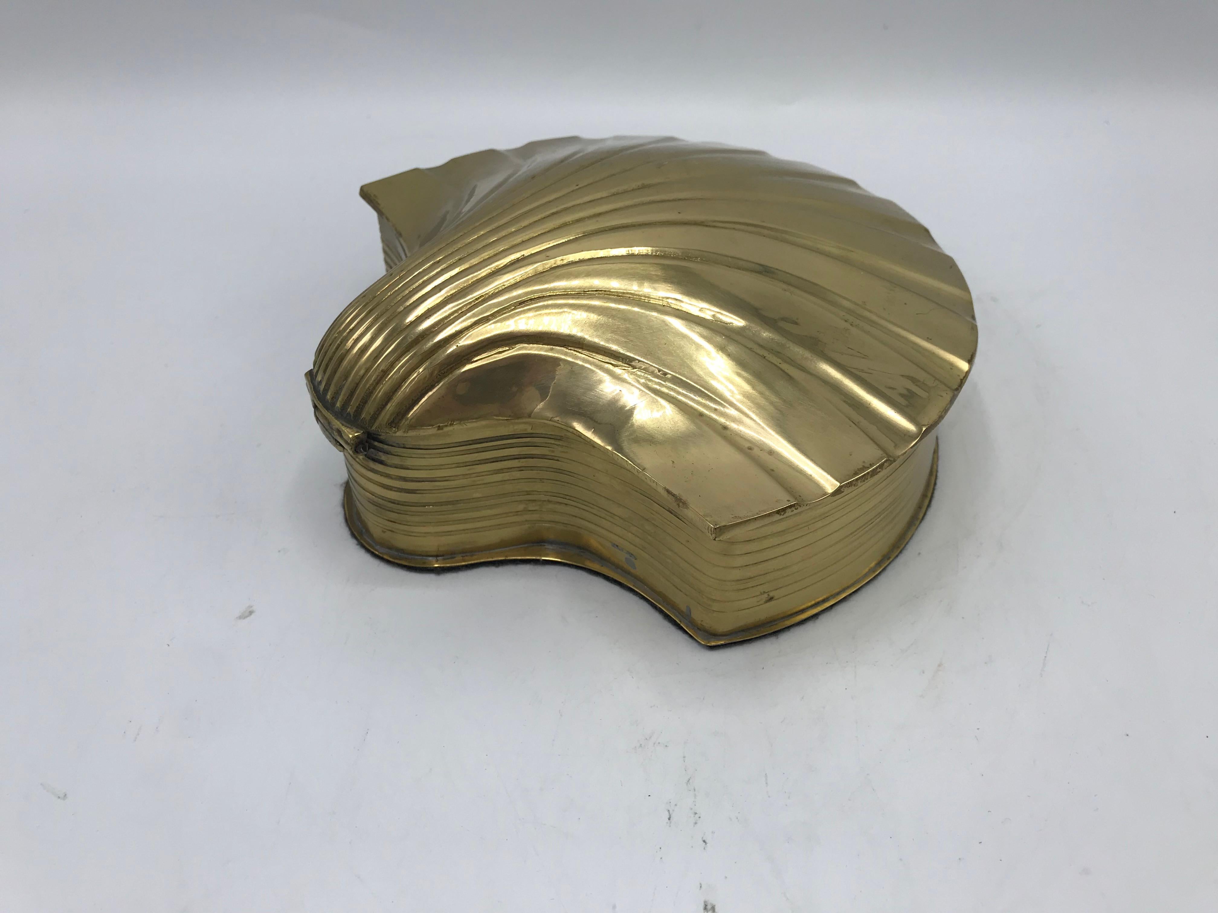 Offered is a gorgeous, 1960s polished brass box in the shape of a seashell. Hinged with felt interior and bottom. Heavy.