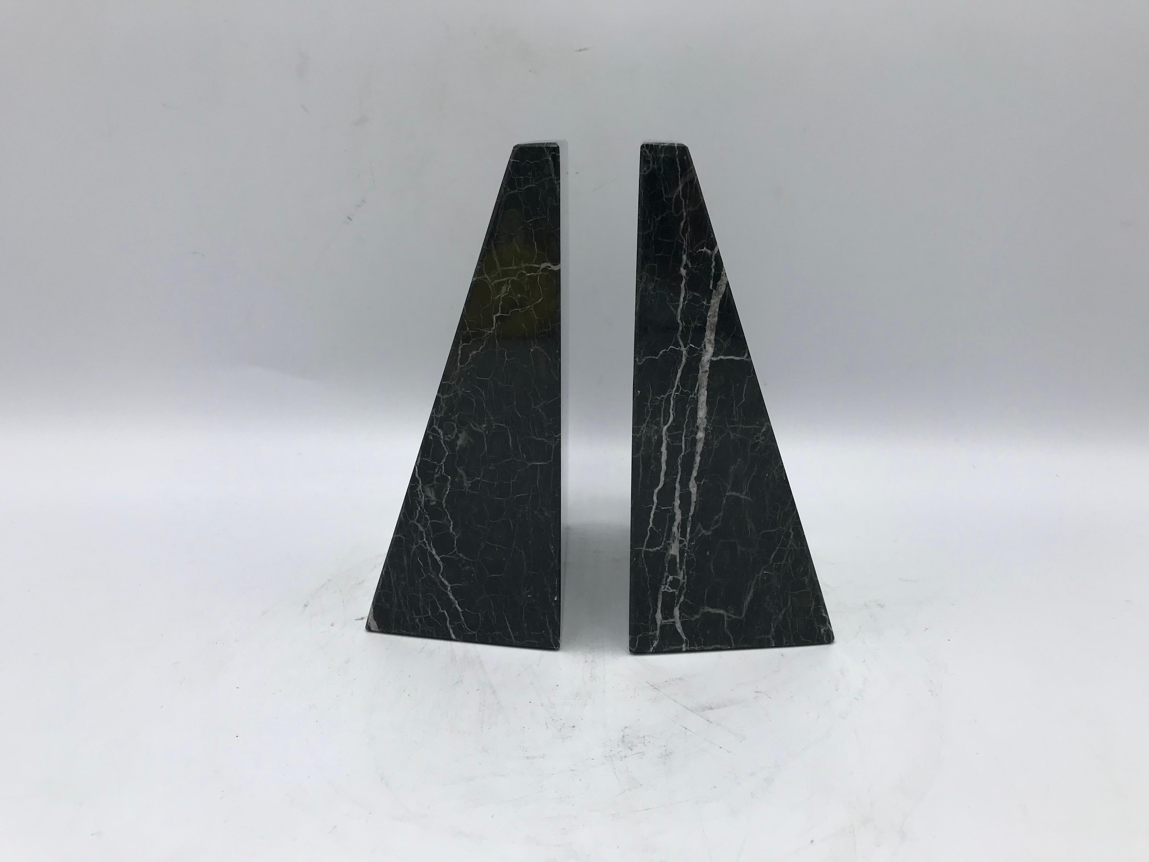 Listed is an exquisite, pair of 1970s Italian polished-marble bookends. Dark green, black, and white coloring all-over. Heavy.