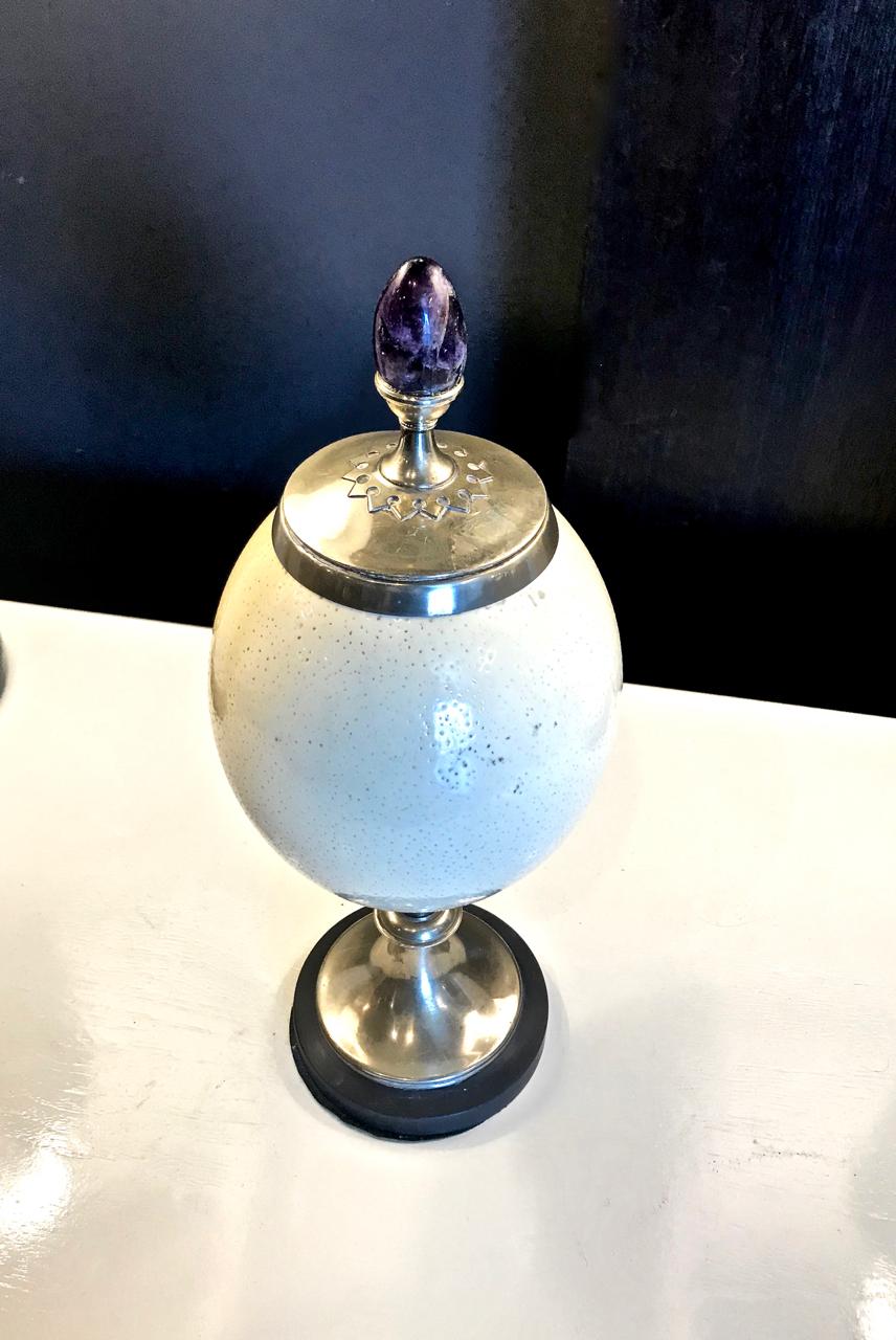 This is a great example of an Anthony Redmile ostrich egg decoration. The ostrich egg is embellished with silver plated fittings and deep purple amethyst.