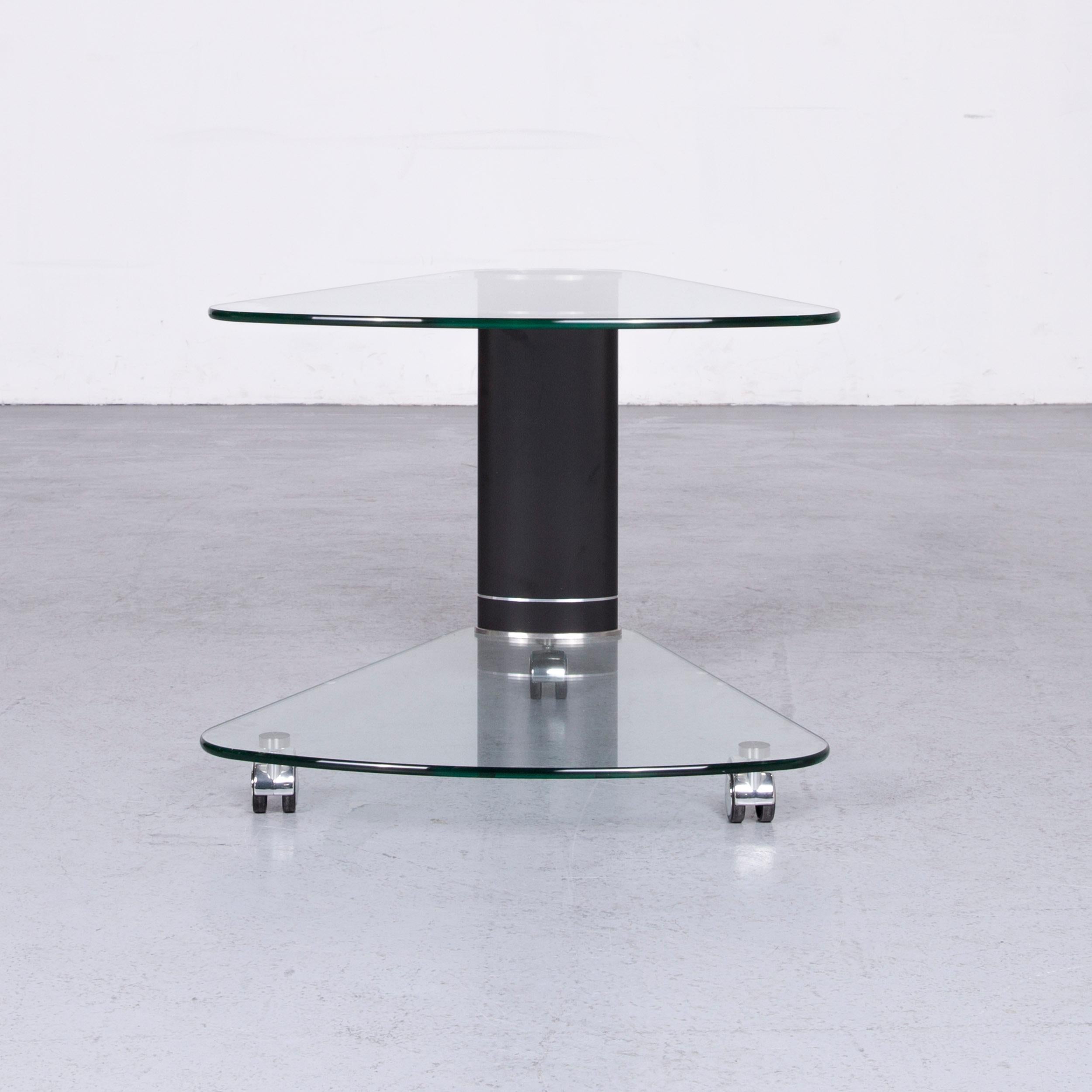 We bring to you a stressless Jazz designer glass table black coffee table.











 
