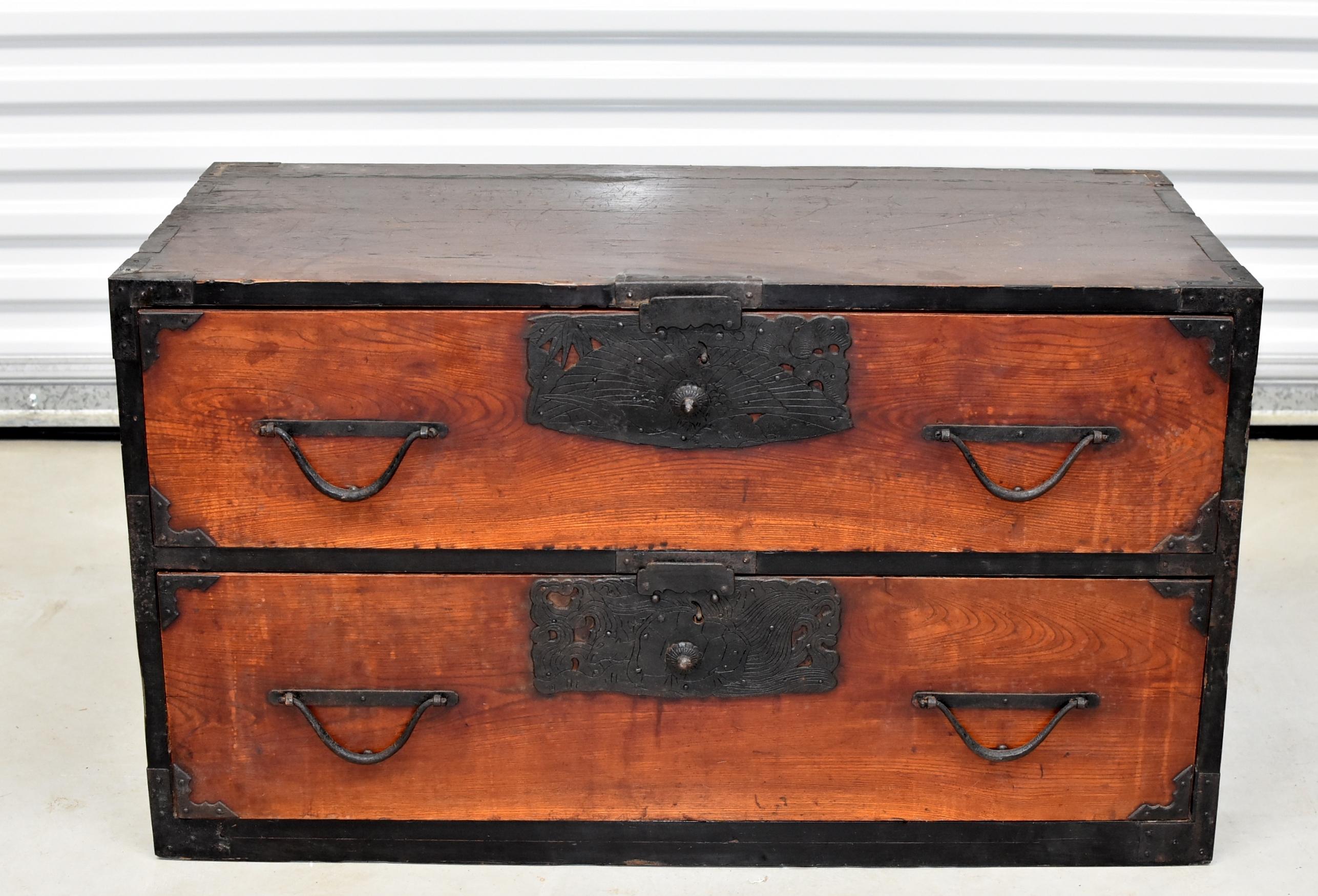 A beautiful vintage, Meiji Period, Japanese Low Tansu with two full size drawers. Large, unique, solid iron hardware features cranes and bamboos, symbols of long life and advancement. Elegant drawer pulls. A very versatile piece. All original.
 