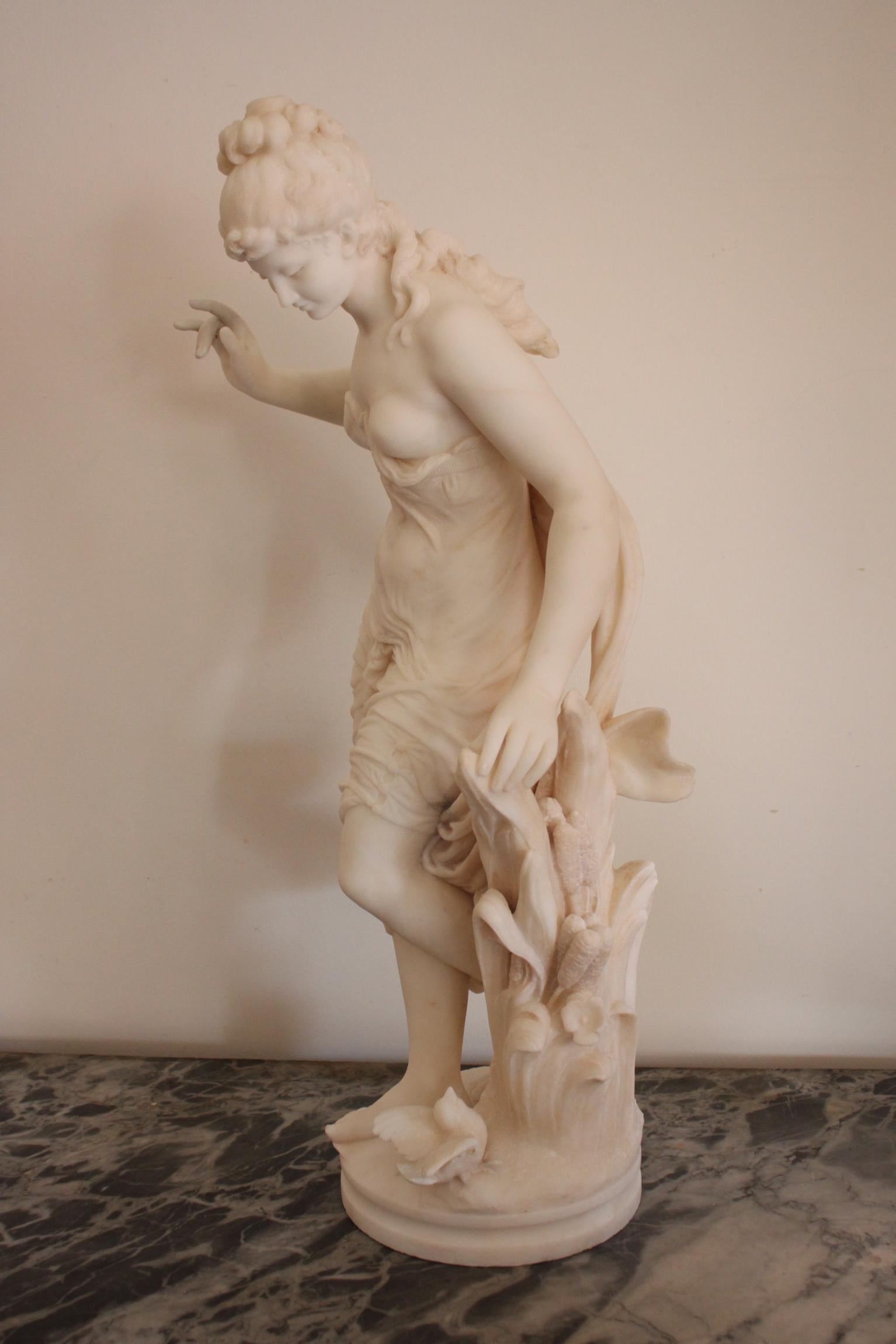 A 19th century marble sculpture by Italian artist Fausto Biggi, in carrara marble. 
Beautiful figurative sculpture representing a draped woman with a bird on the base.
The fingers has been restaured. Signed on the base.
Dimensions: Height 77.5cm,