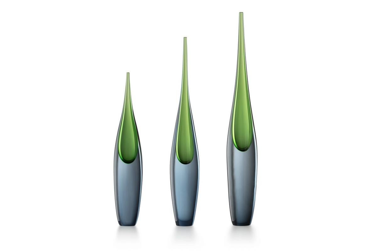 Pinnacolo in gray steel and green grass Murano's blown glass

The tall and slender Pinnacolo vases were designed by Luciano Gaspari and made using his favorite technique, the sommerso. The sunken blue and green glass versions were showcased at the