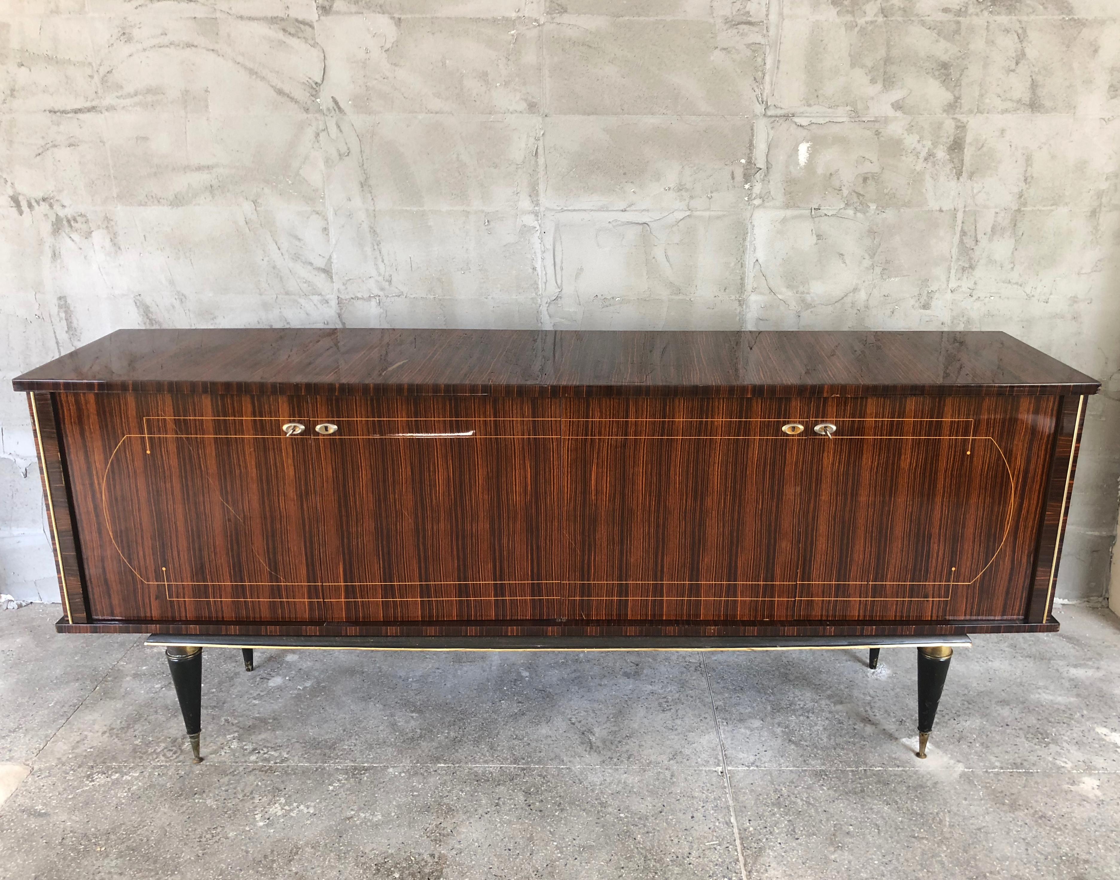 Exquisite French luxury Art Deco sideboard made in France in the 1940s in a reputable furniture factory. Impressive Macassar wood, magnificently crafted both inside and outside.